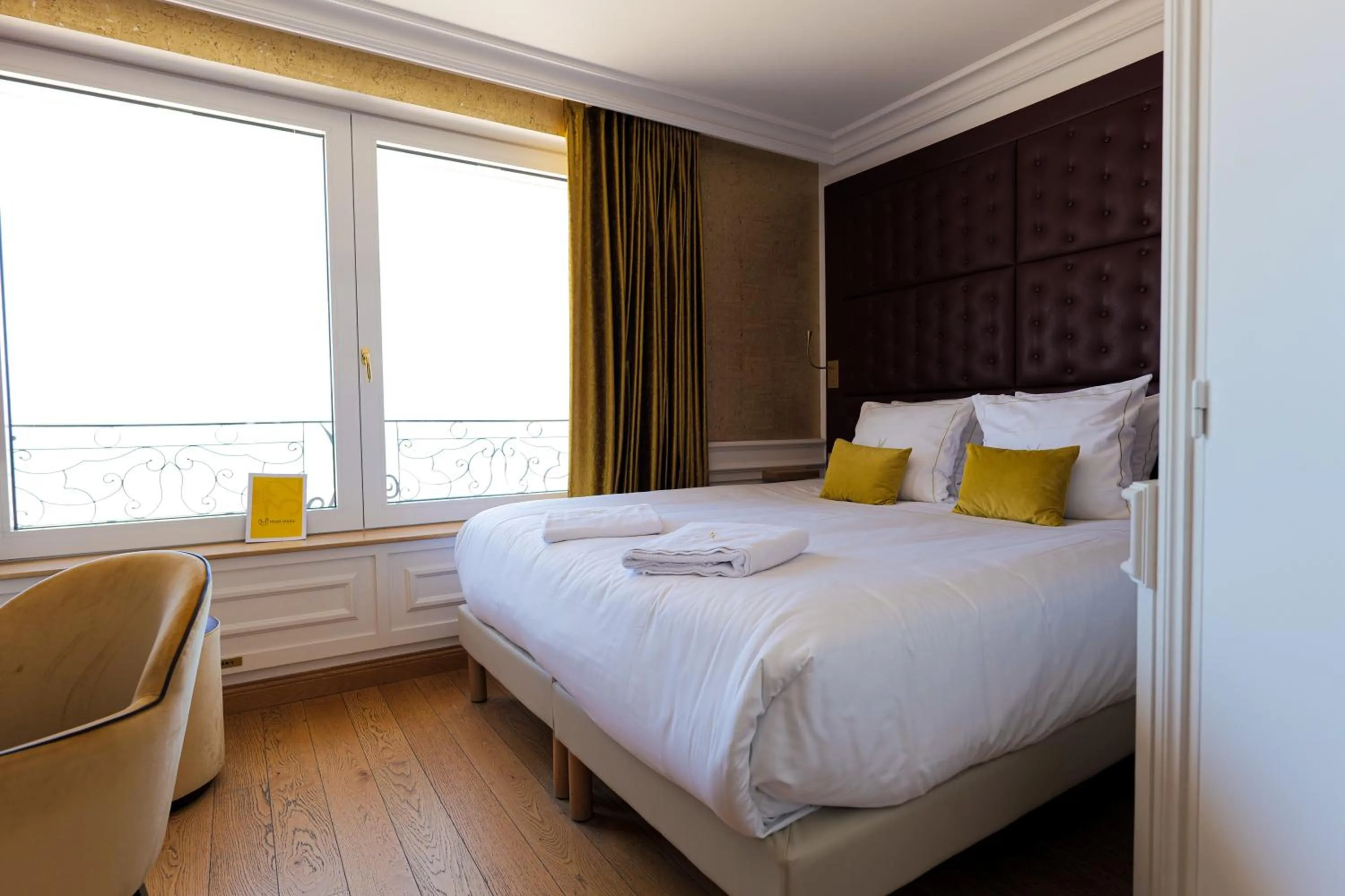 Bed in Hôtel Merveilleux Côté Mer