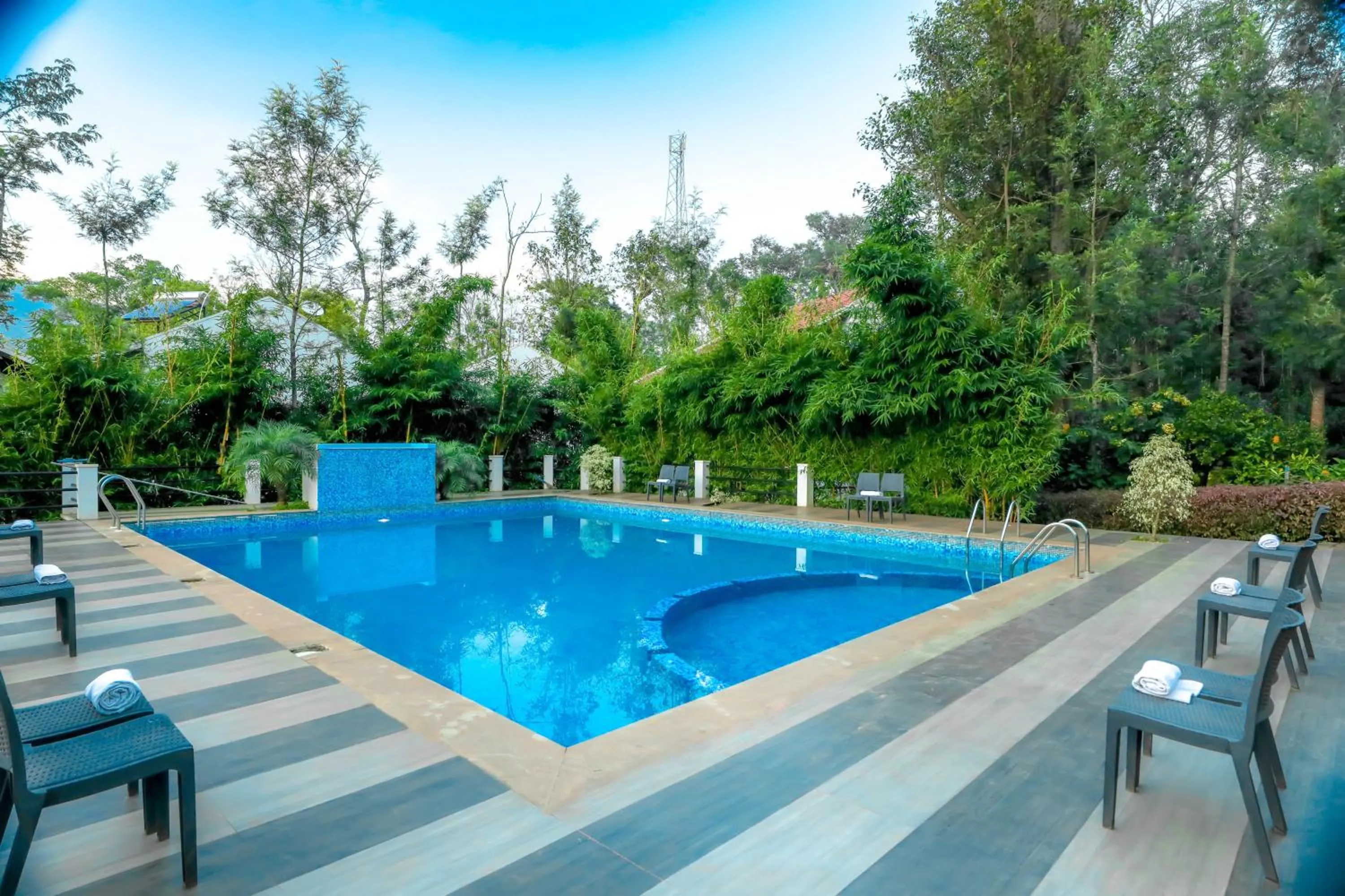 Swimming pool in The Blossom Resort - Chikmagalur