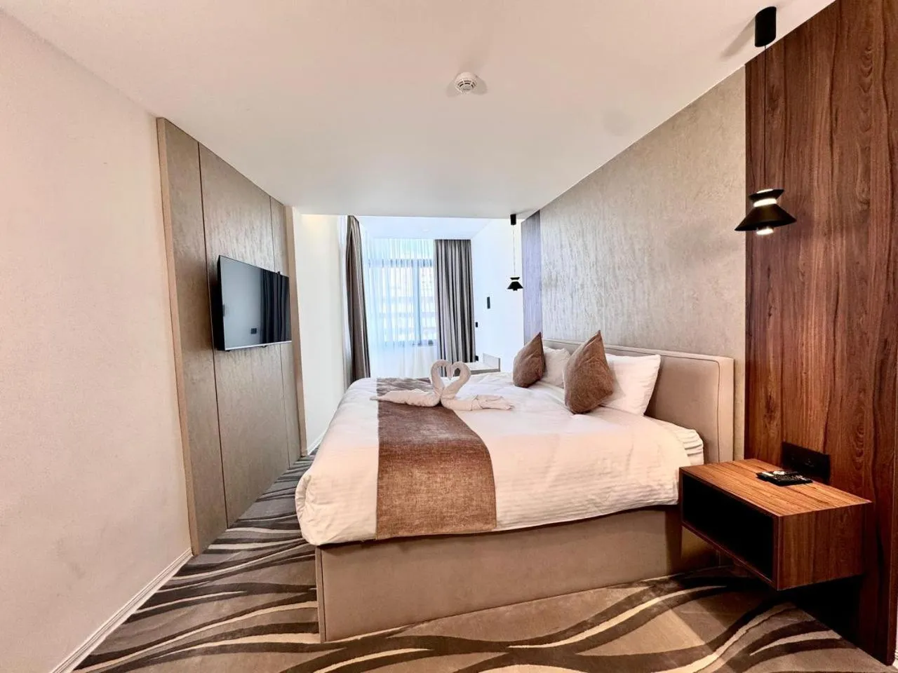 Bed in New MerryLand Hotel