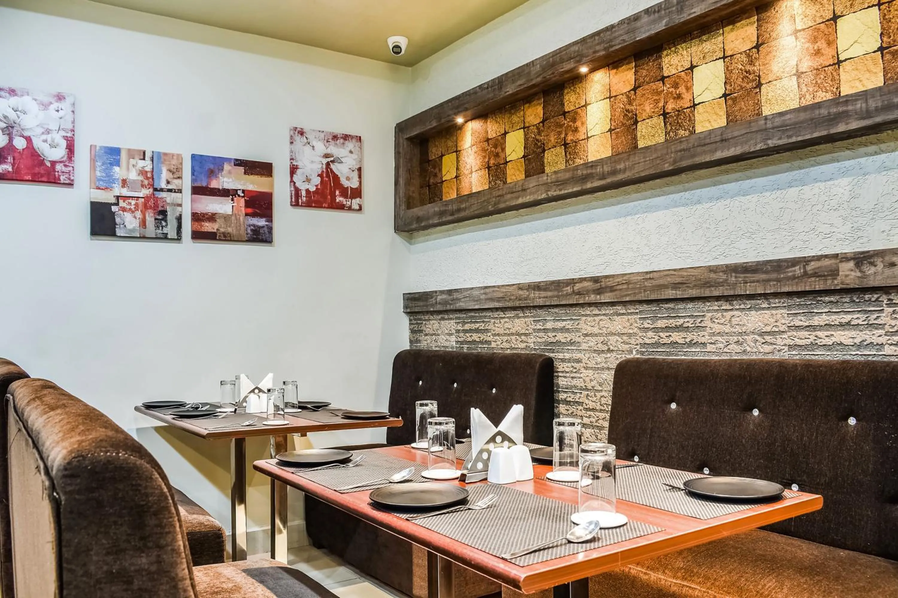 Dining area in Capital O Jai Adisson