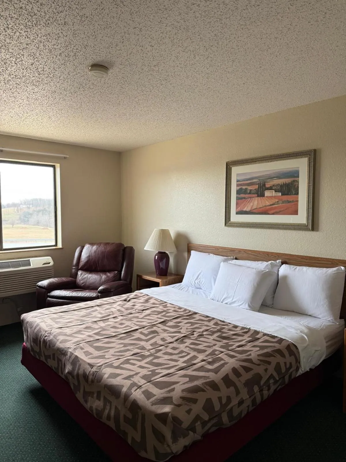 Bed in Cassville Four Seasons Inn & Suites