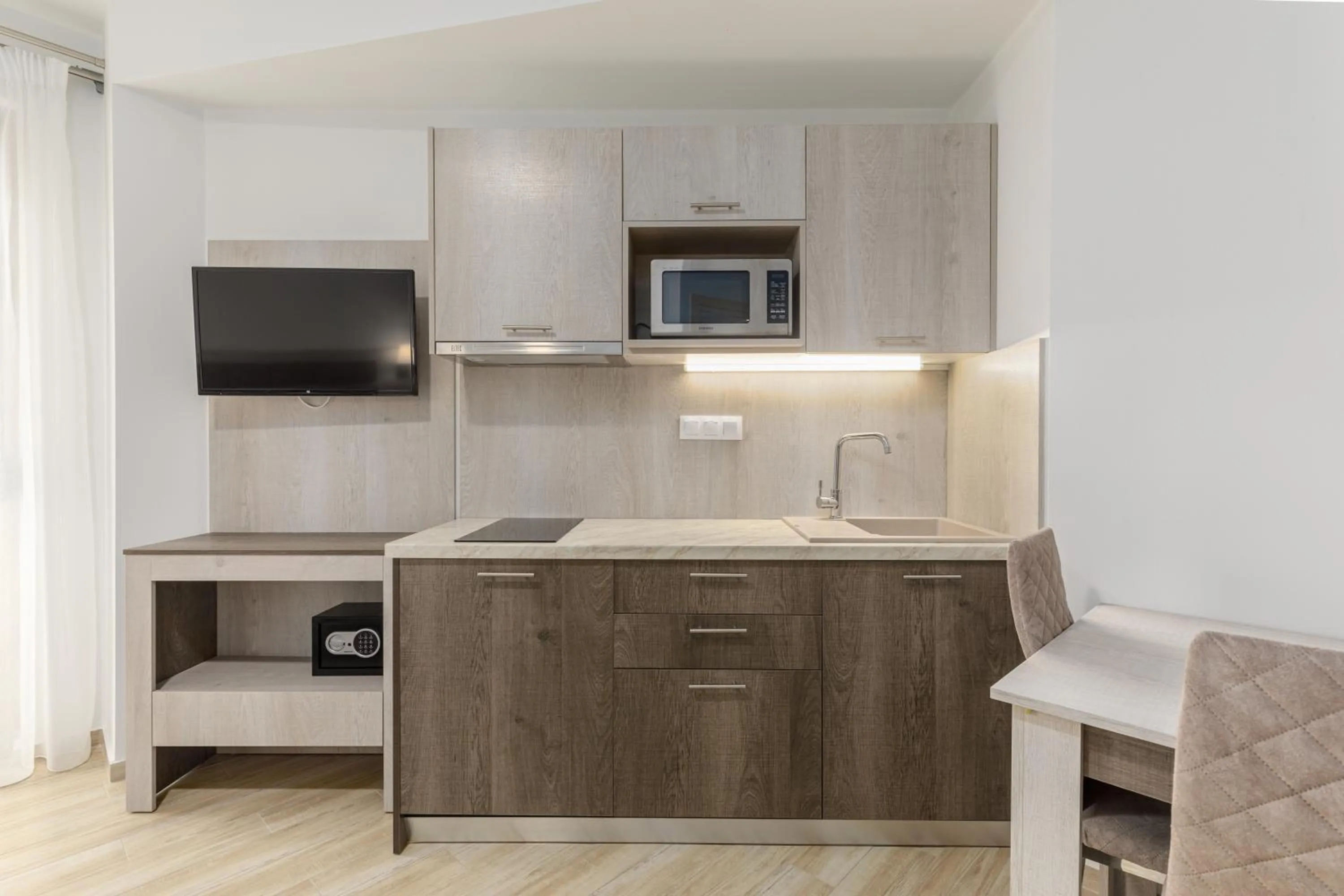 Kitchen or kitchenette in Aria Garden Suites
