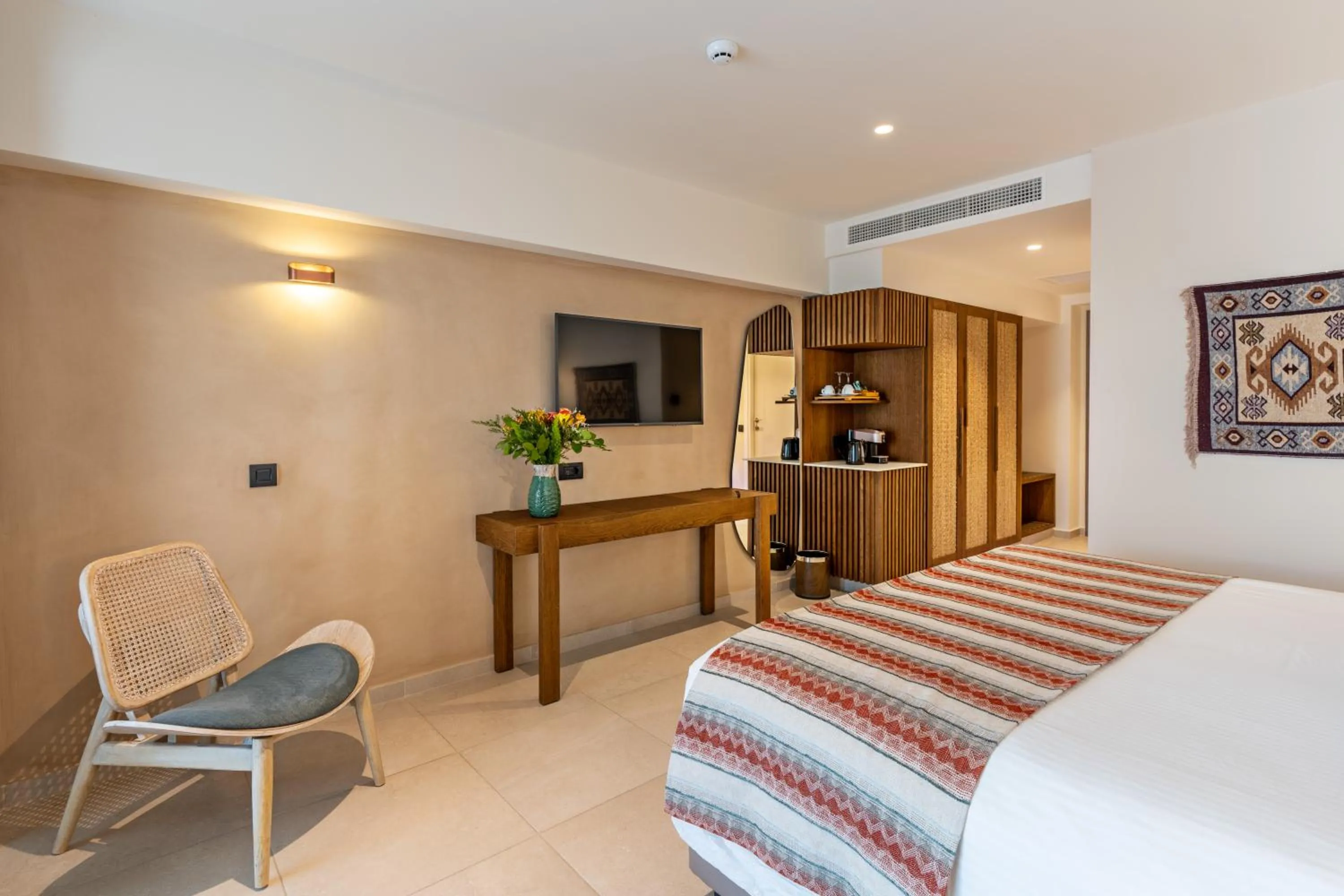 TV and multimedia, Bed in Minos Ambassador Suites & Spa - Adults only