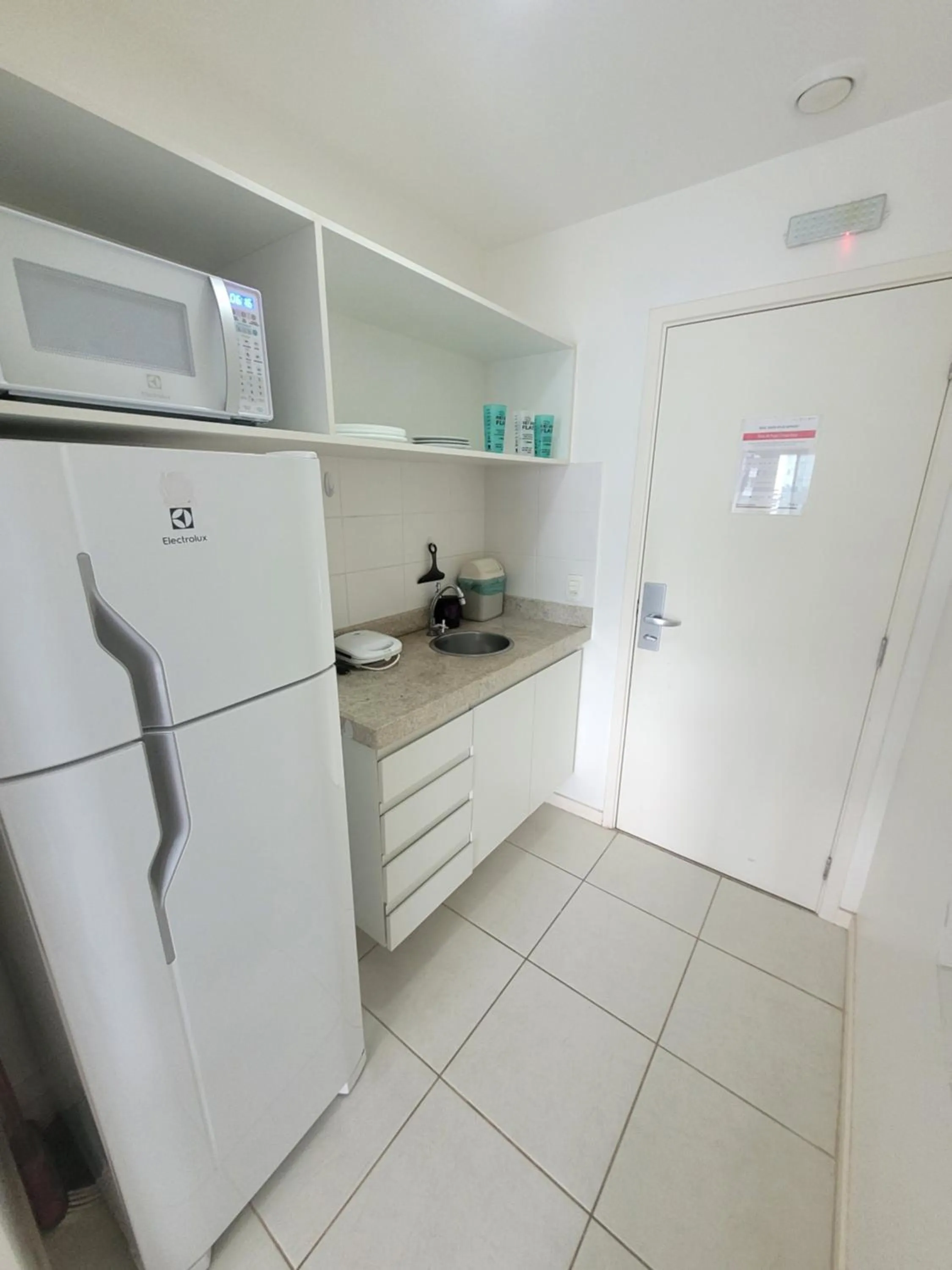 Kitchen or kitchenette in Flat Vision Executivo Premium By Rei dos Flats