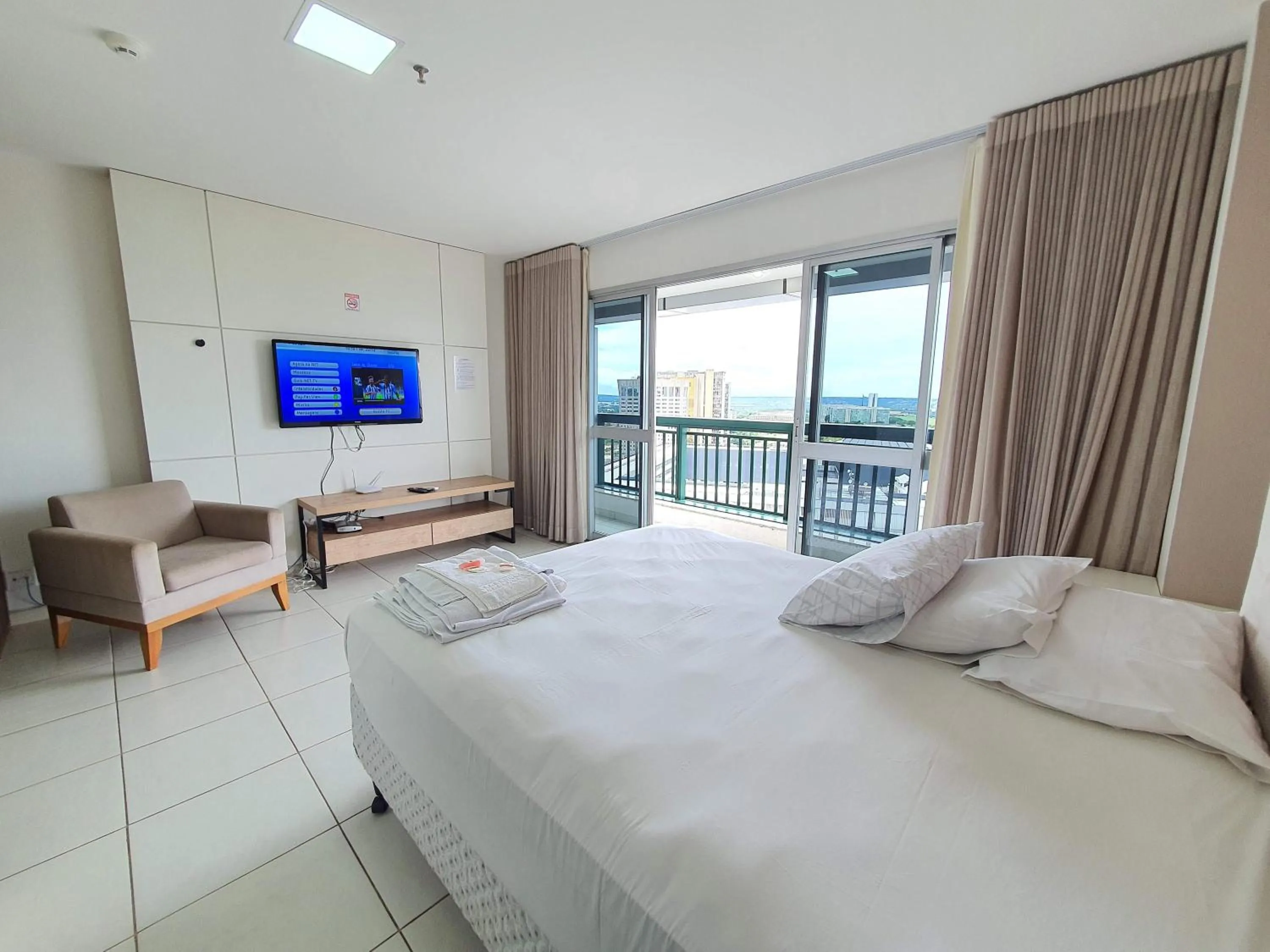 Communal lounge/ TV room, Bed in Flat Vision Executivo Premium By Rei dos Flats