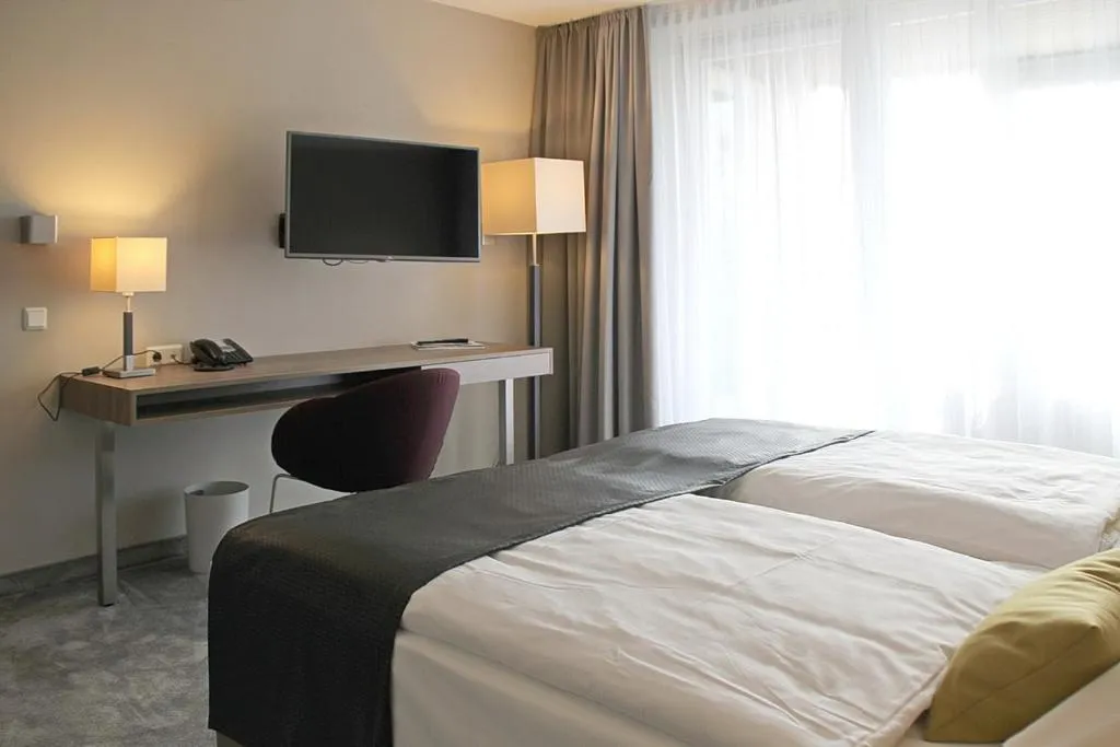 Photo of the whole room, Bed in Upstalsboom Parkhotel