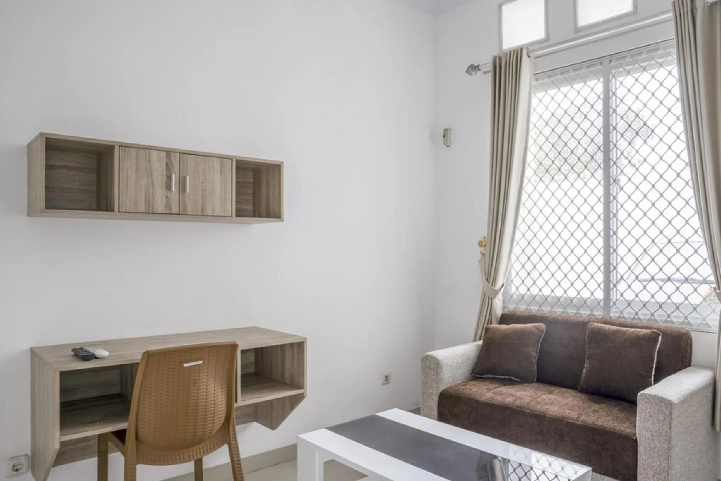 Living room in RedDoorz Syariah near RSUD Kota Bogor