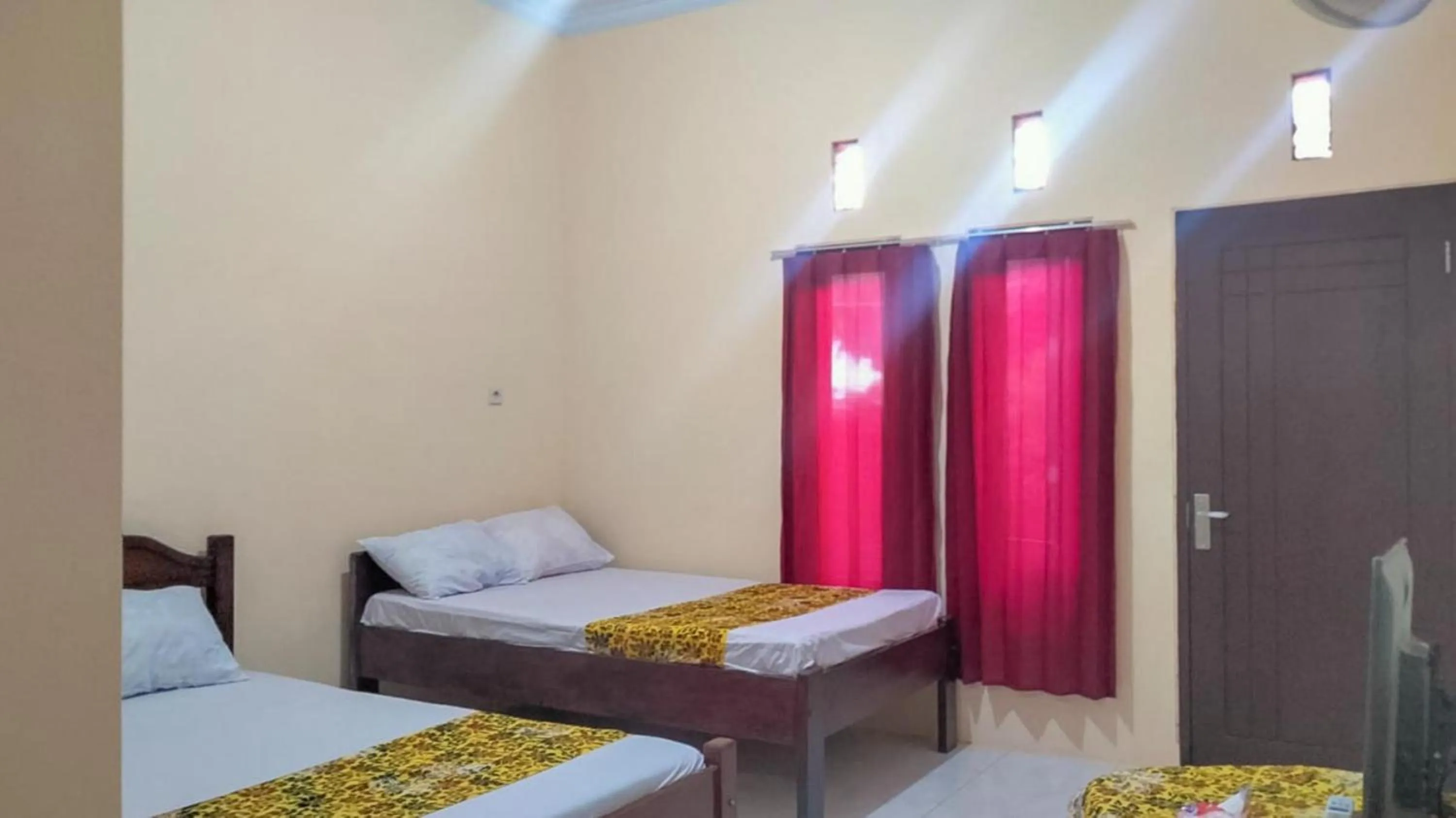 Bed in Zulfina Homestay Syariah Mitra RedDoorz