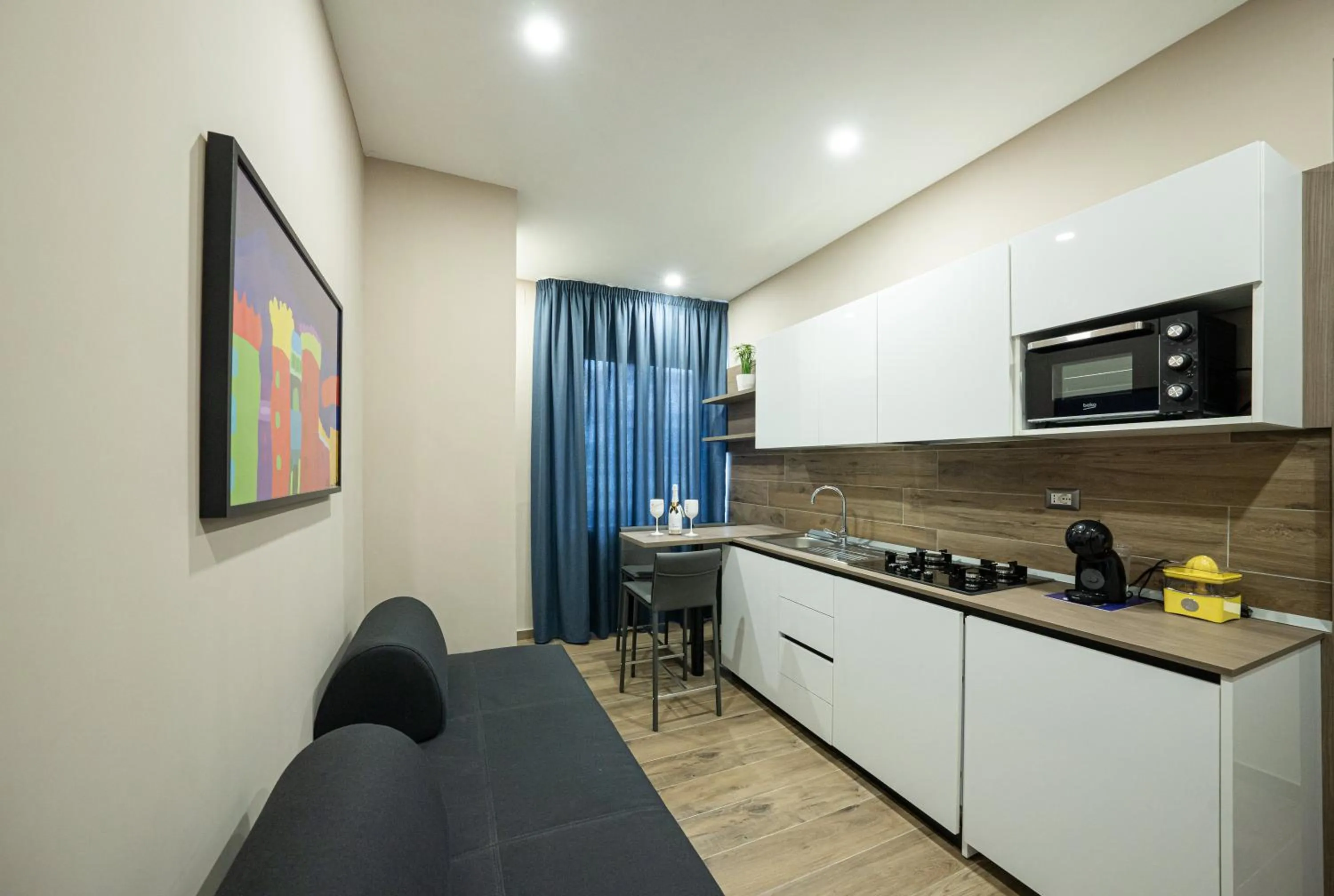 Kitchen or kitchenette in Famalu apartments