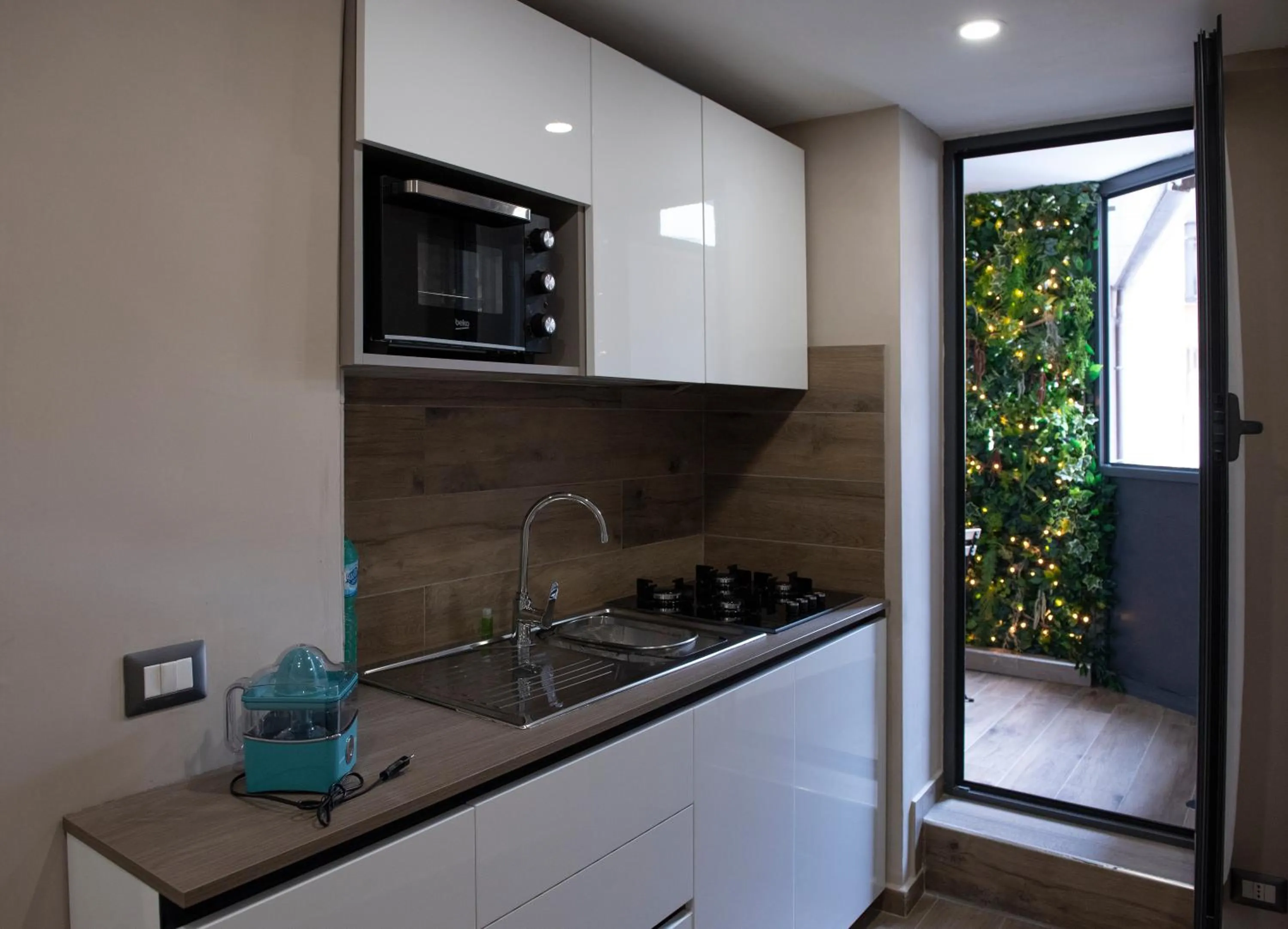 Kitchen or kitchenette in Famalu apartments