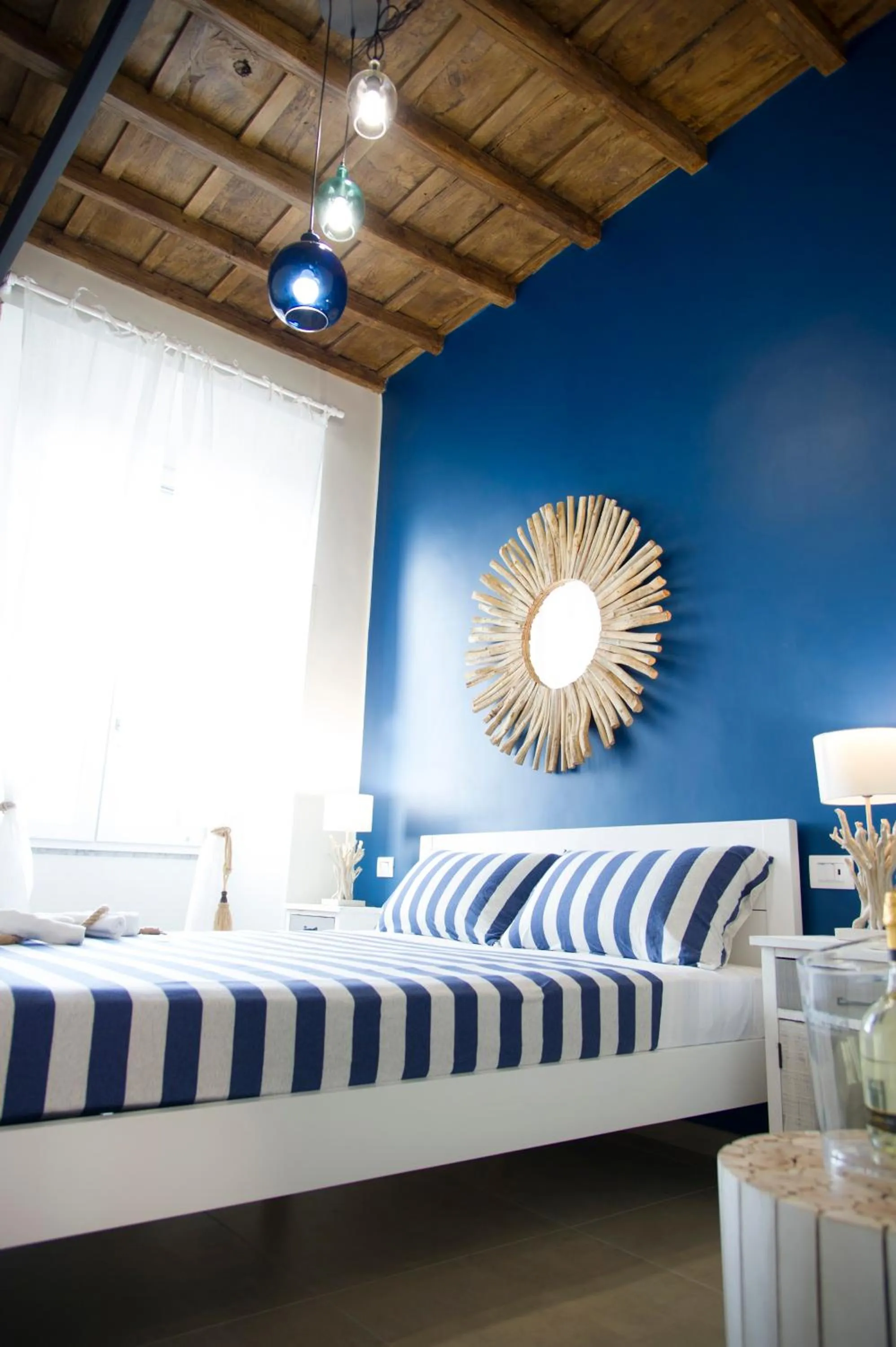 Bed in Le Boutique Luxury Rooms diffused in Historic Center