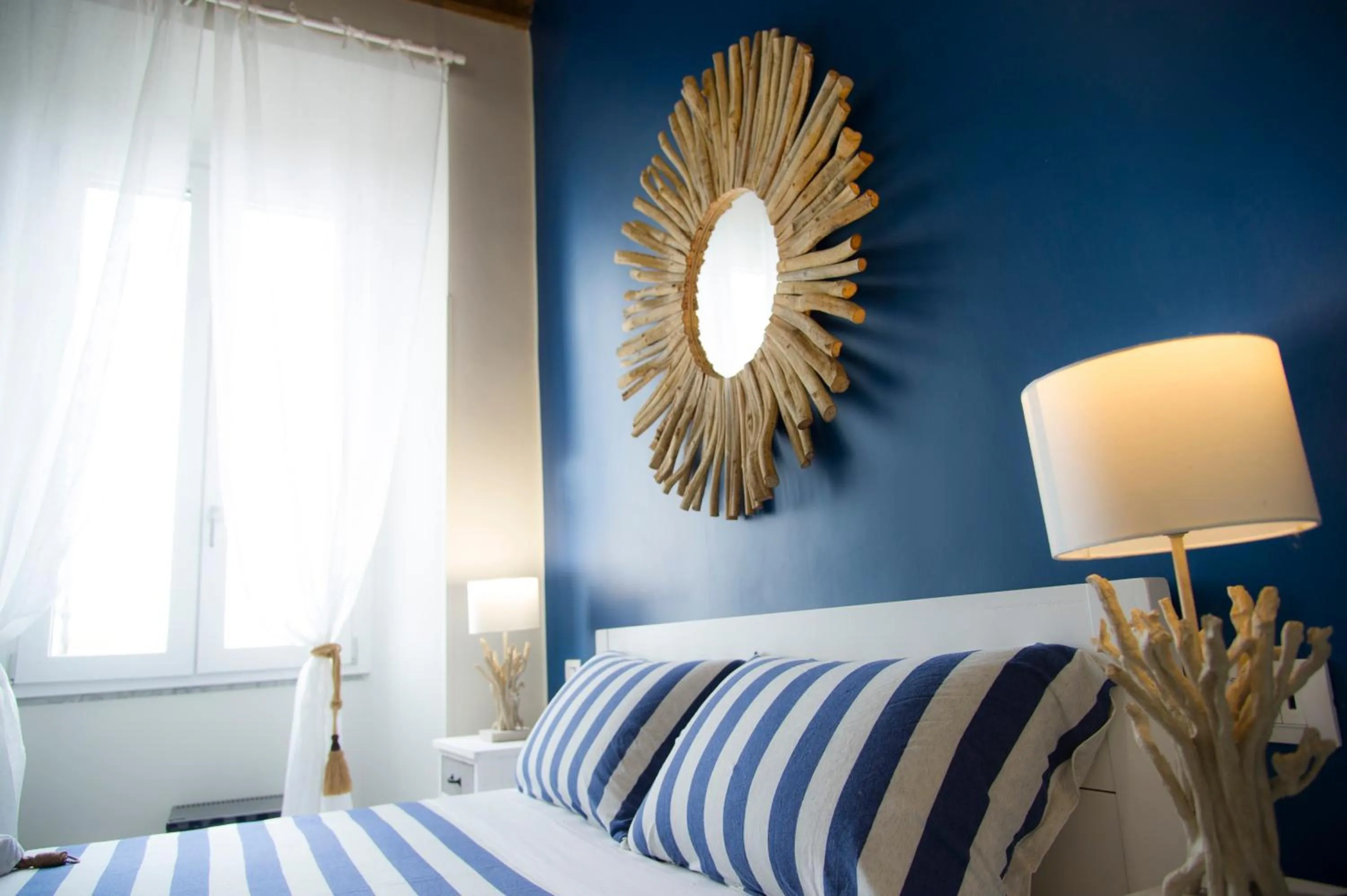 Bed in Le Boutique Luxury Rooms diffused in Historic Center