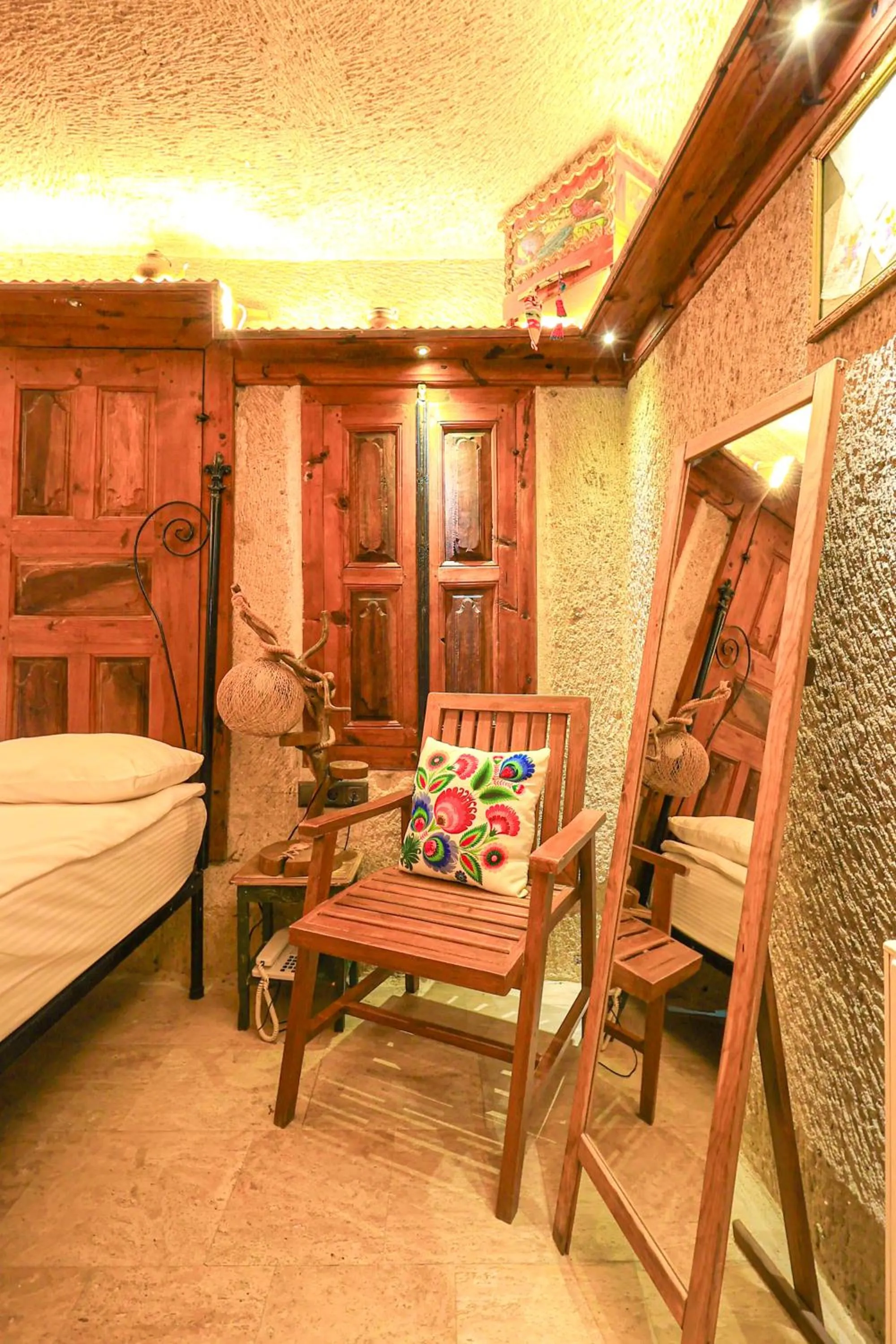 Seating area, Bed in Casia Cave Suites