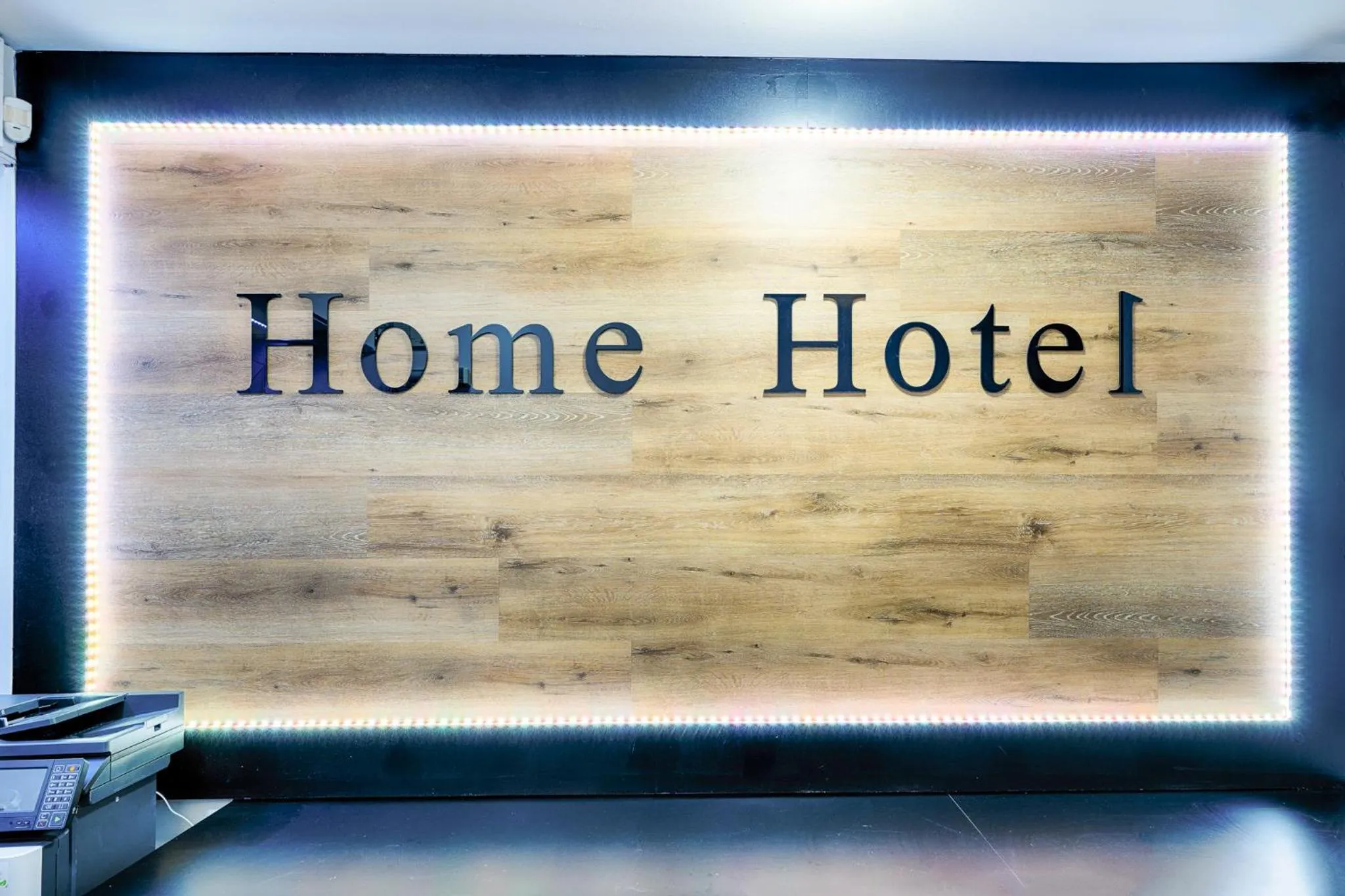 Property logo or sign in Home Hotel