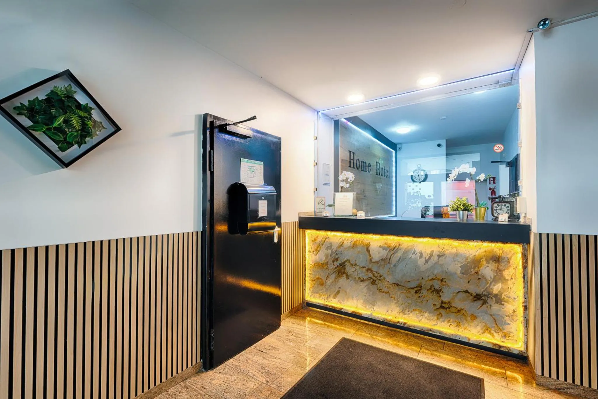 Lobby or reception in Home Hotel