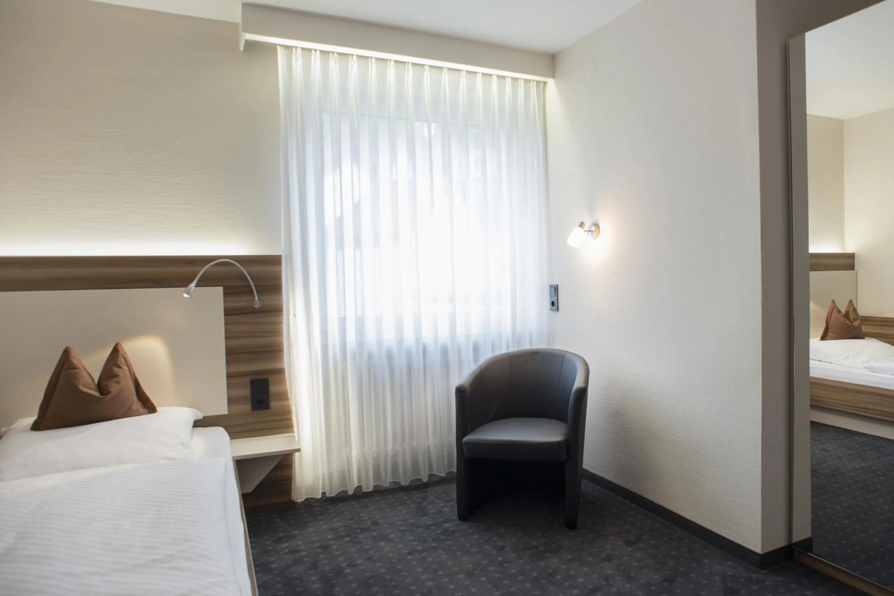 Seating area, Bed in Hotel Kögel