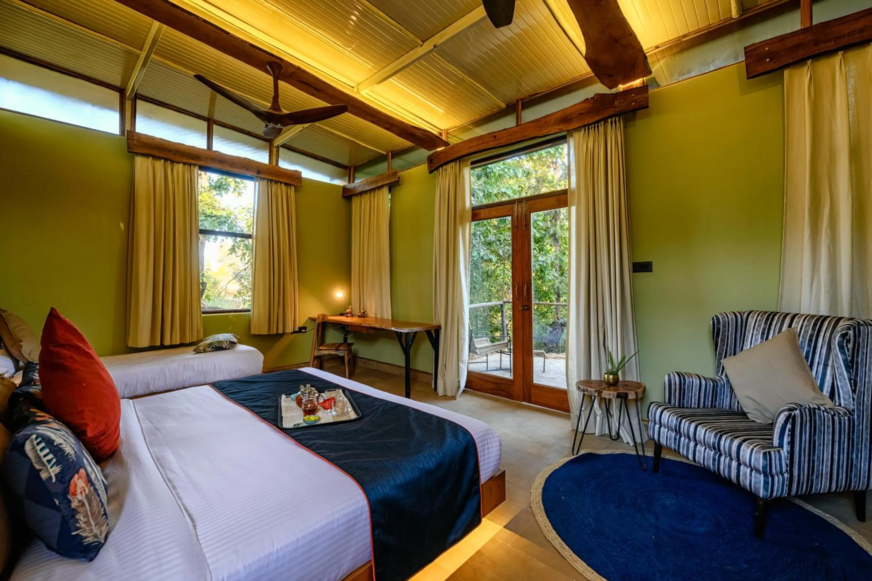 Living room, Bed in Kanha Jungle Camp