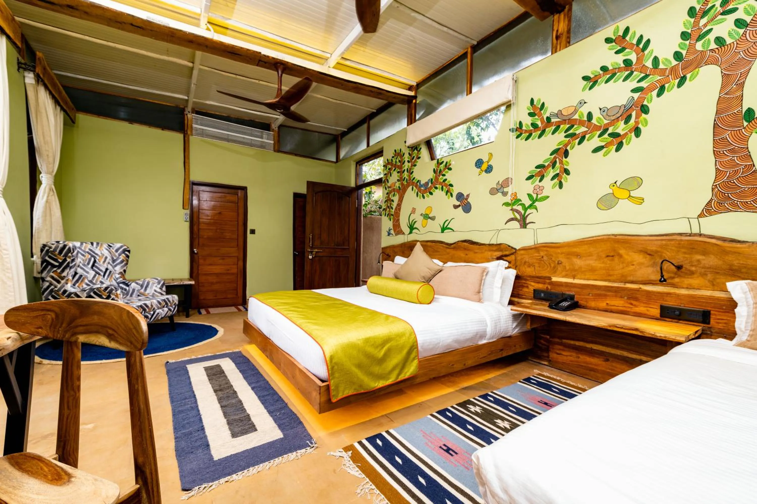 Living room, Bed in Kanha Jungle Camp