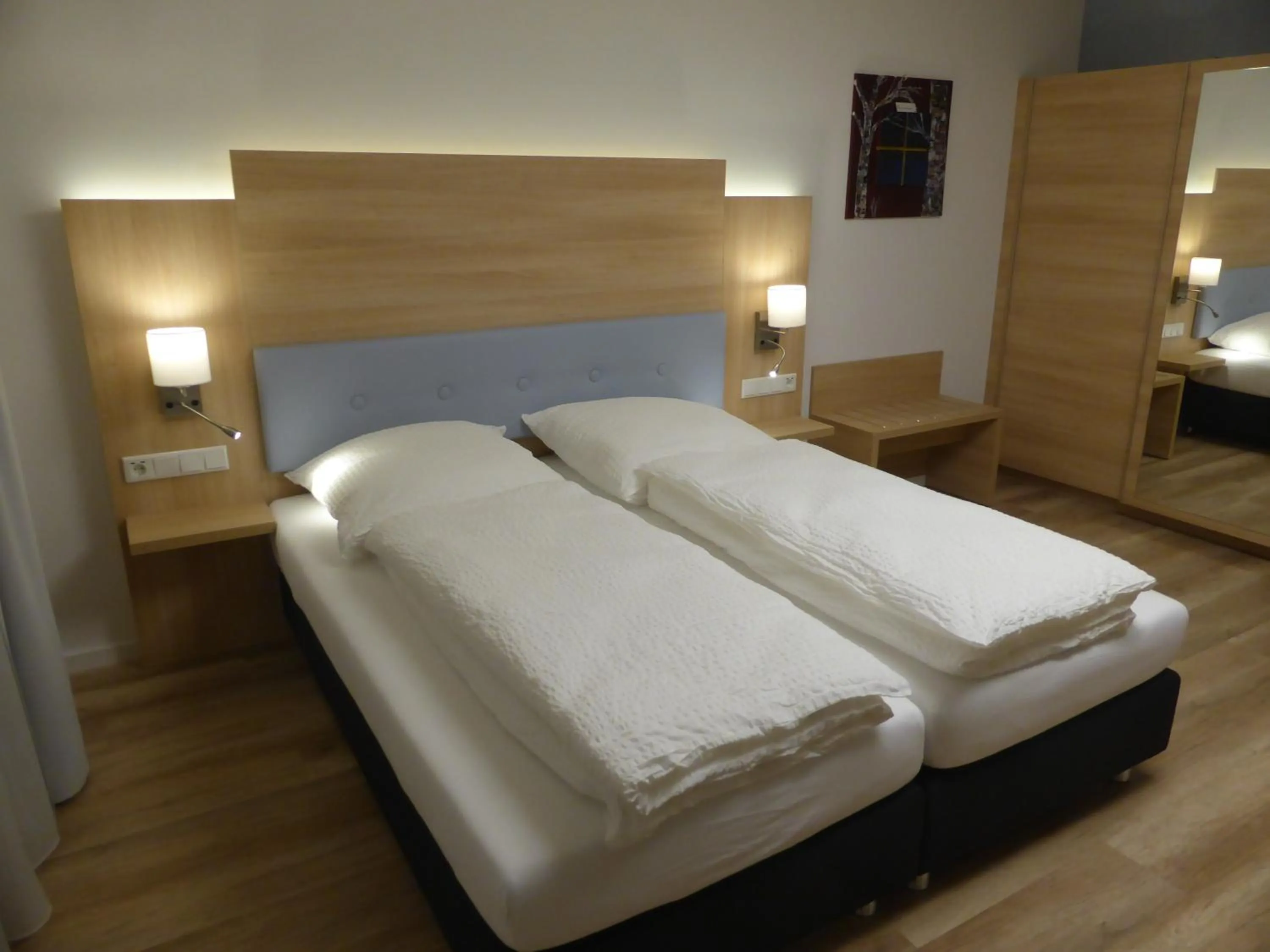 Bed in Leister Apparthotel