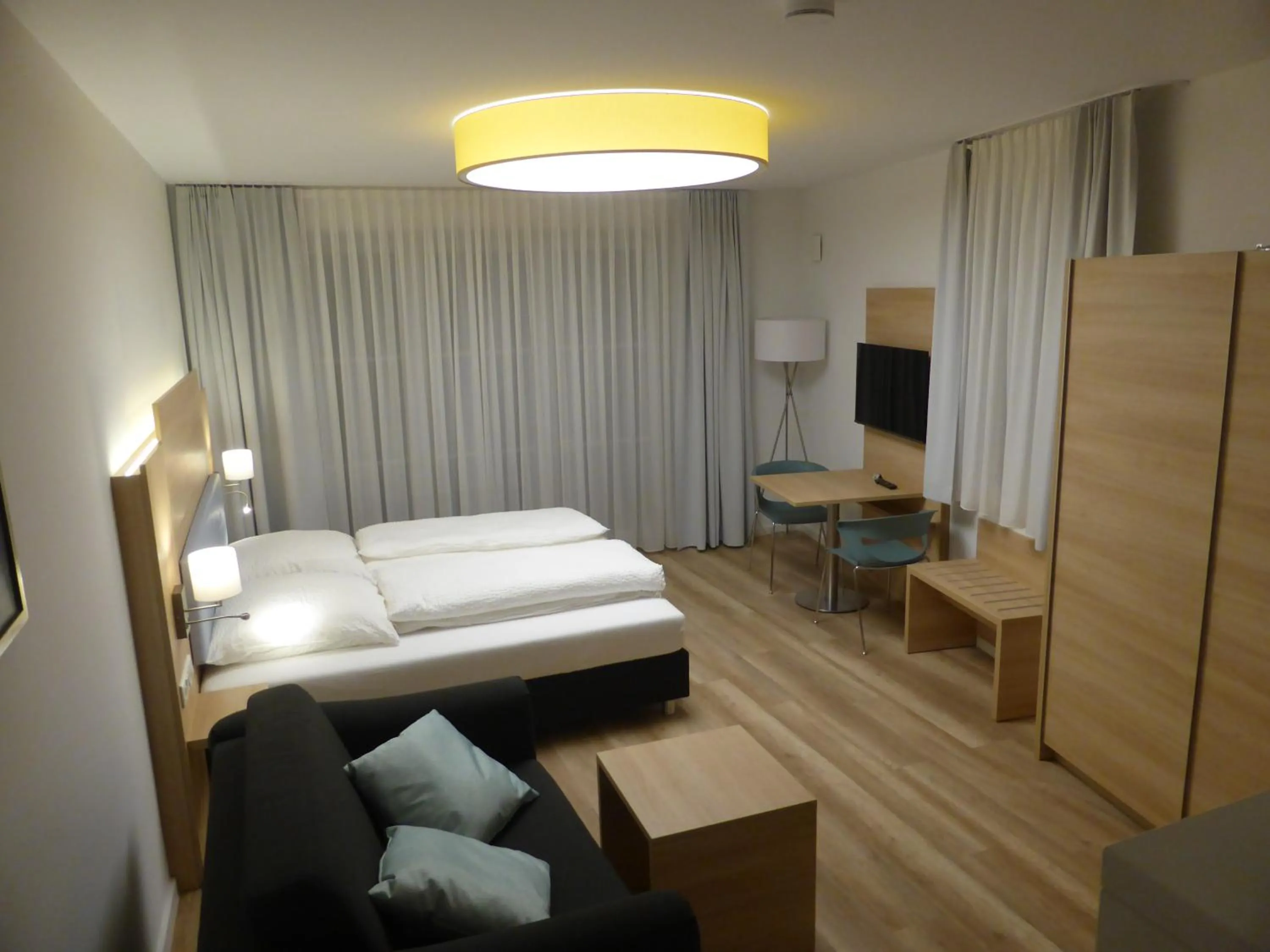 Bed in Leister Apparthotel