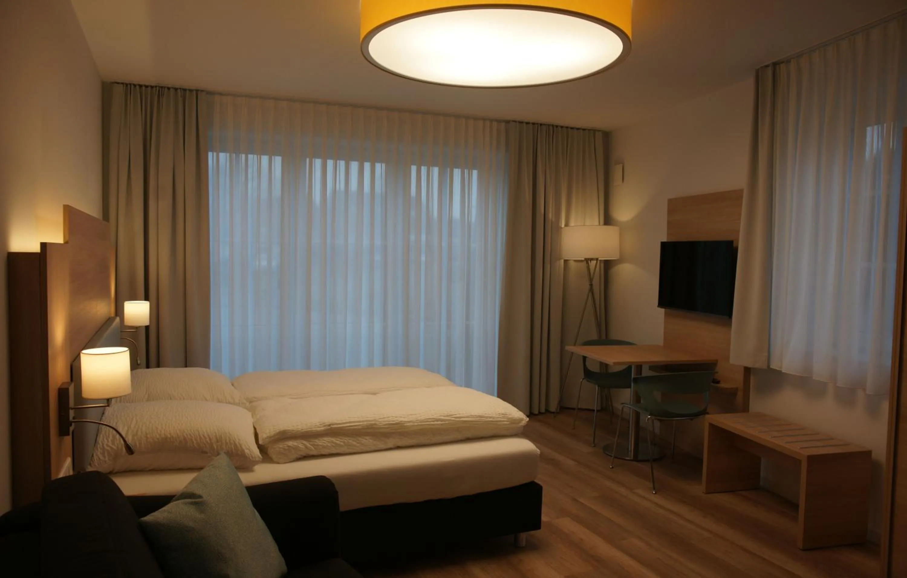 Bed in Leister Apparthotel