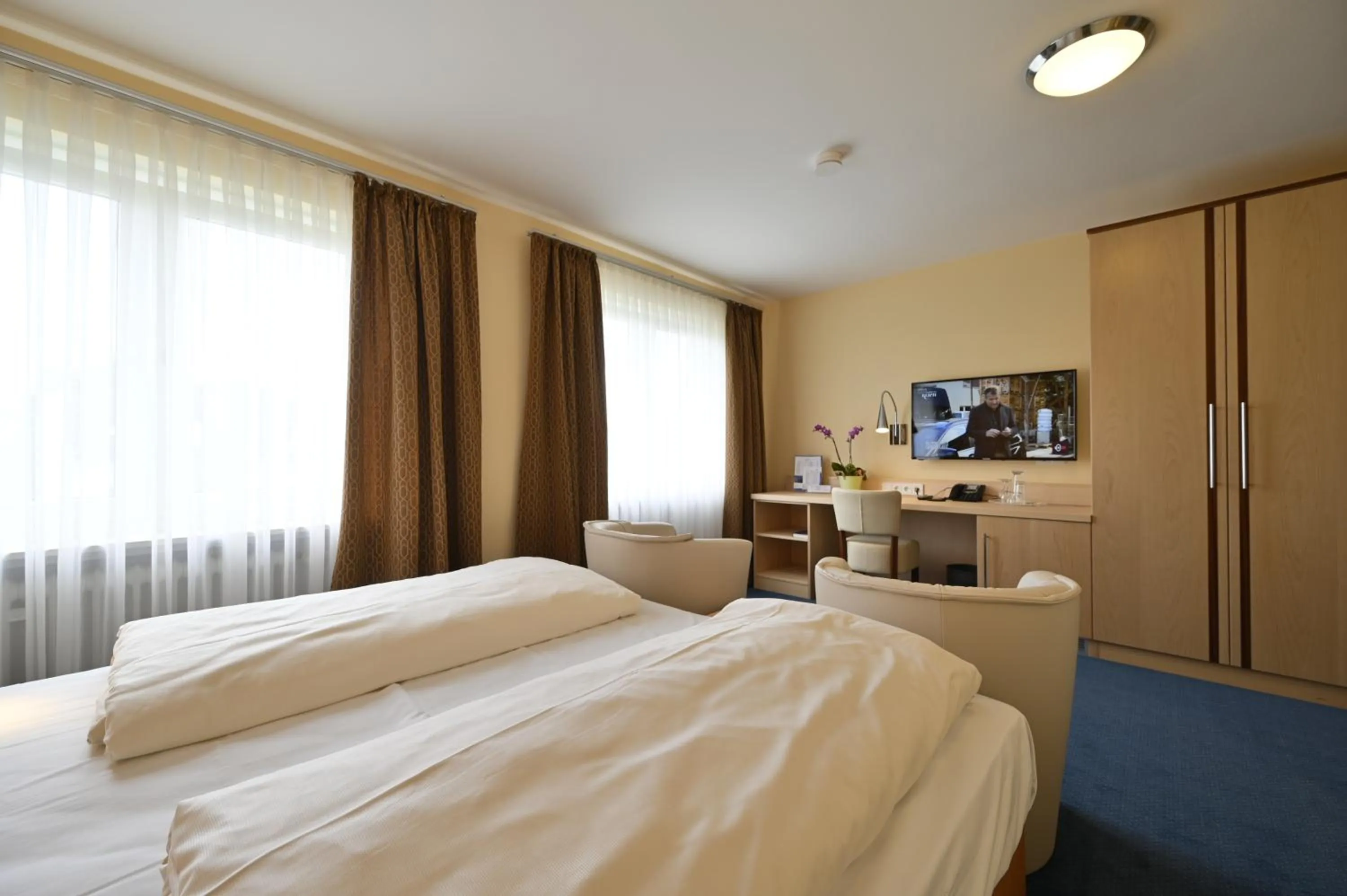 Bed in Hotel Apollo Garni