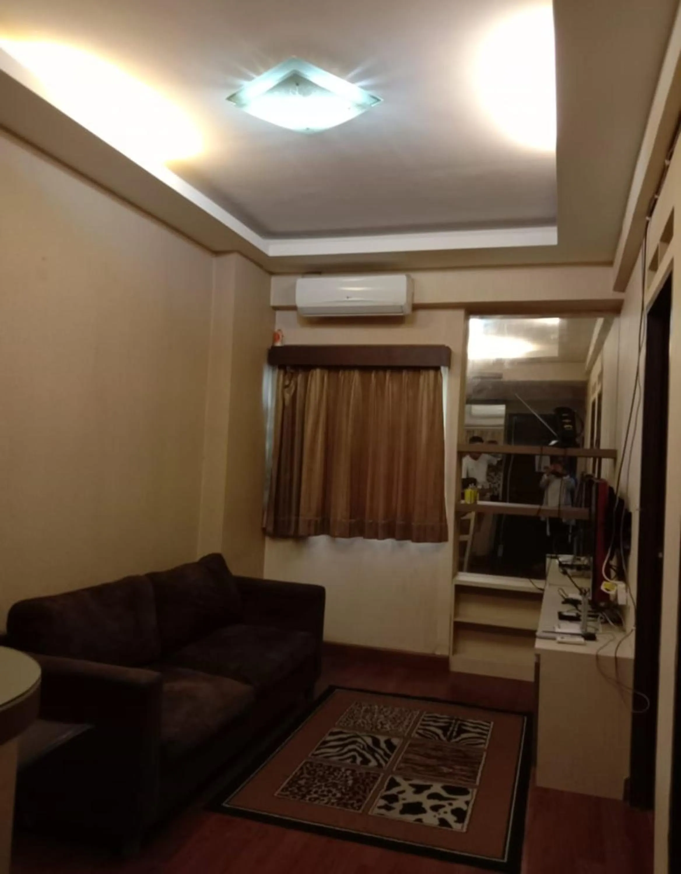 Living room in The Suites Metro Apartment by NFO Property