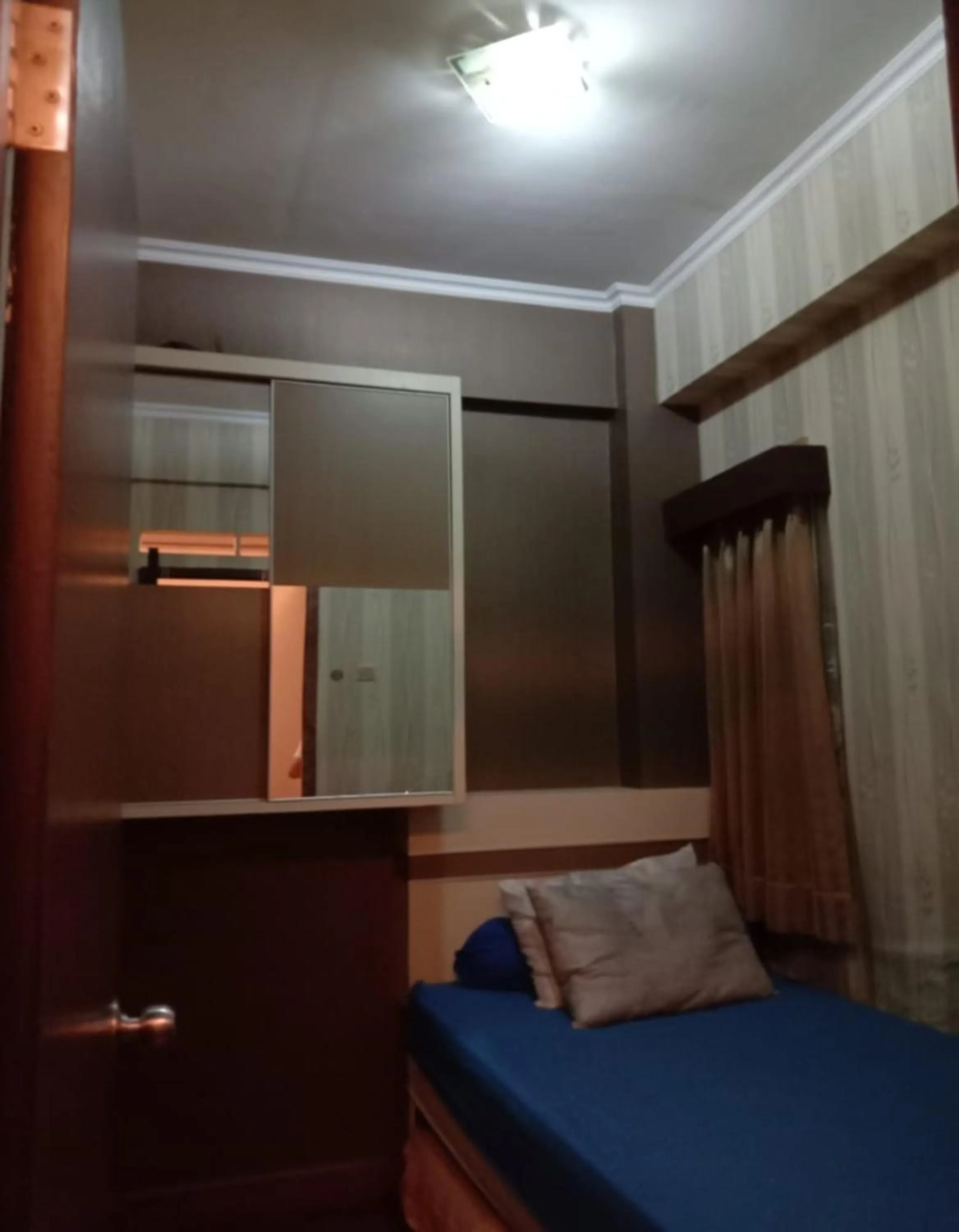 Bedroom, Bed in The Suites Metro Apartment by NFO Property