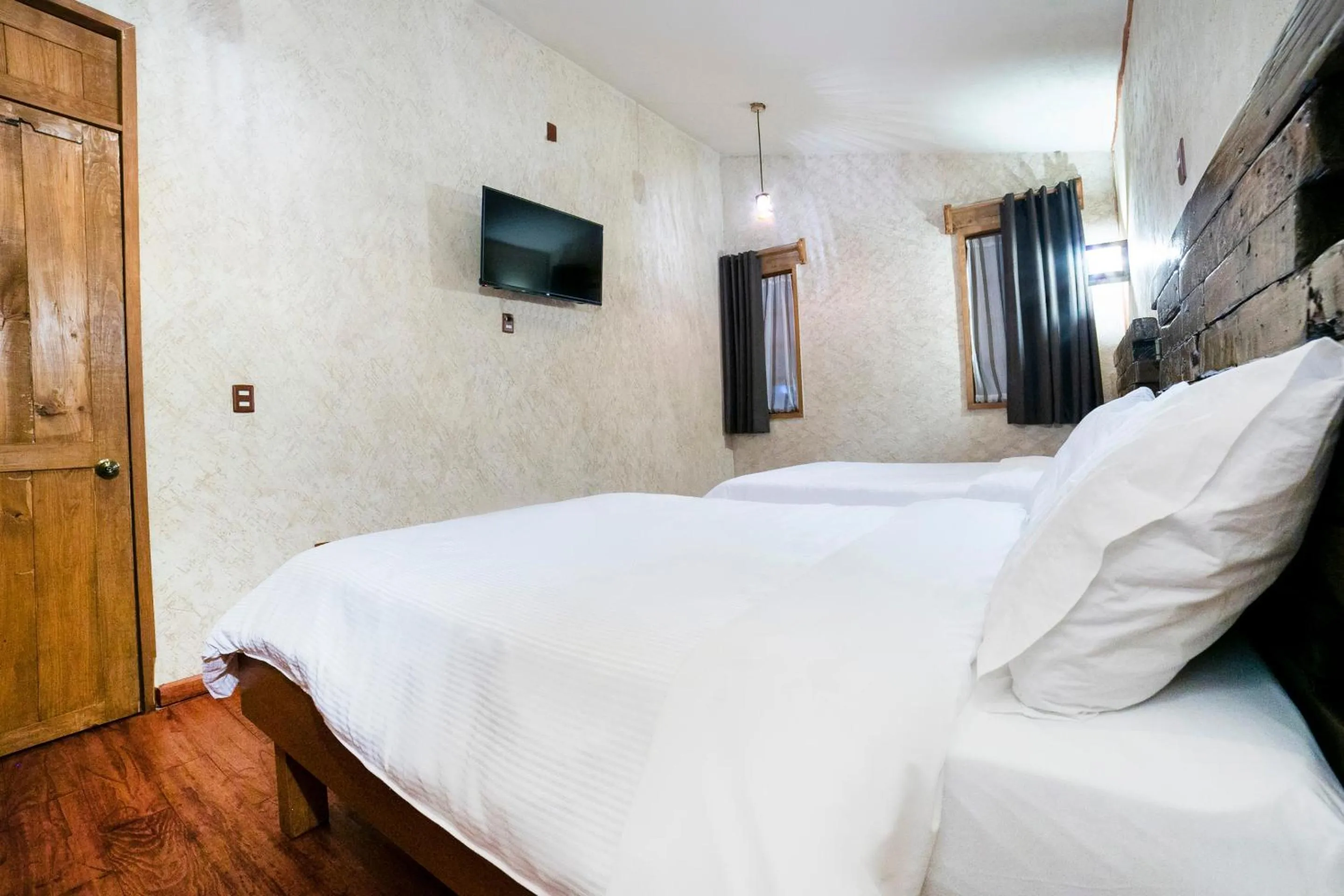 Bedroom in Capital O Collection O Casona De Minas Mineral del Monte