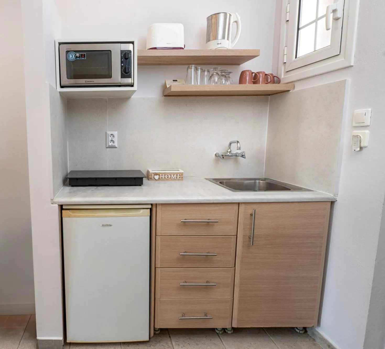 Kitchen or kitchenette in KORINA APART HOTEL KAVOS