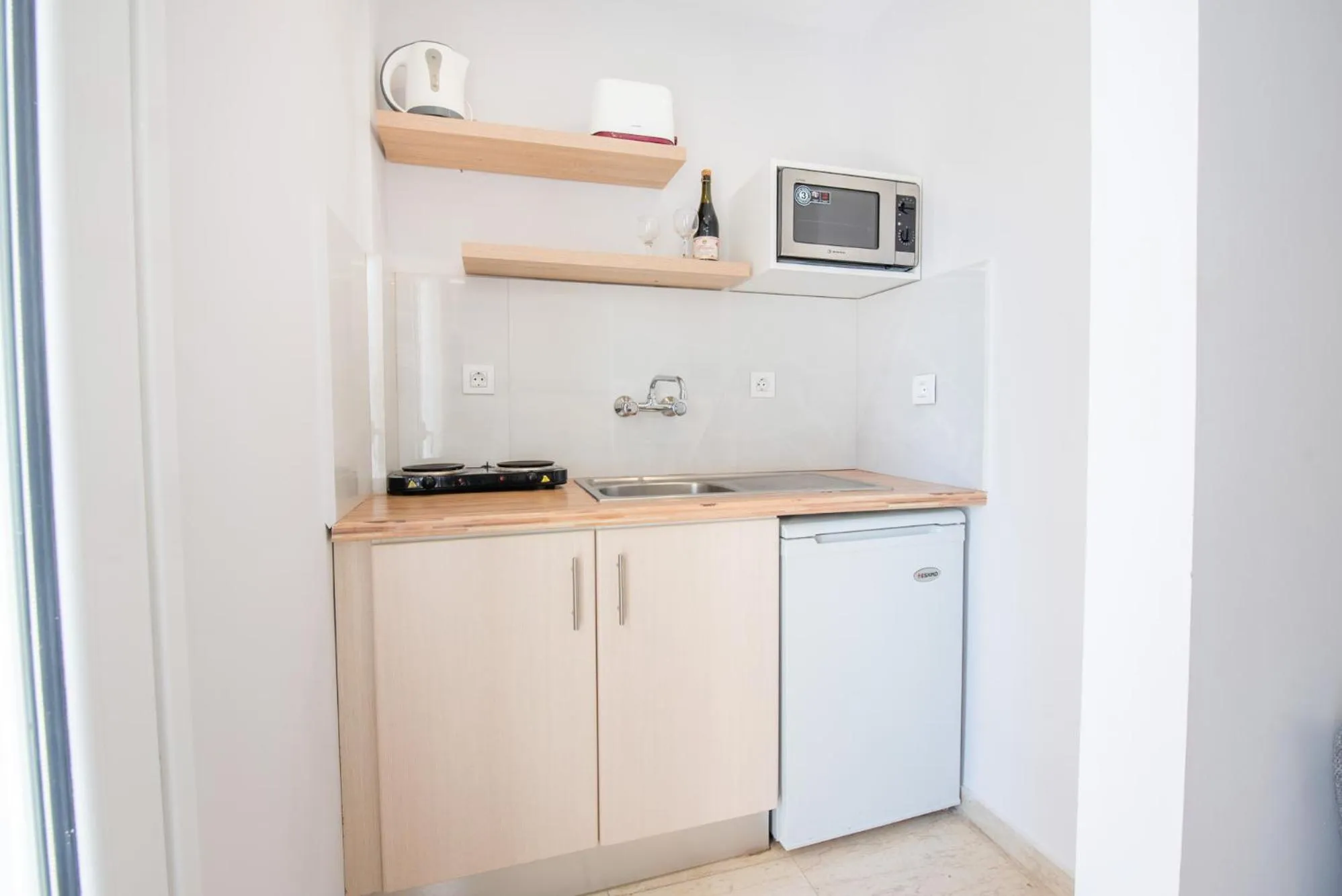 Kitchen or kitchenette in KORINA APART HOTEL KAVOS