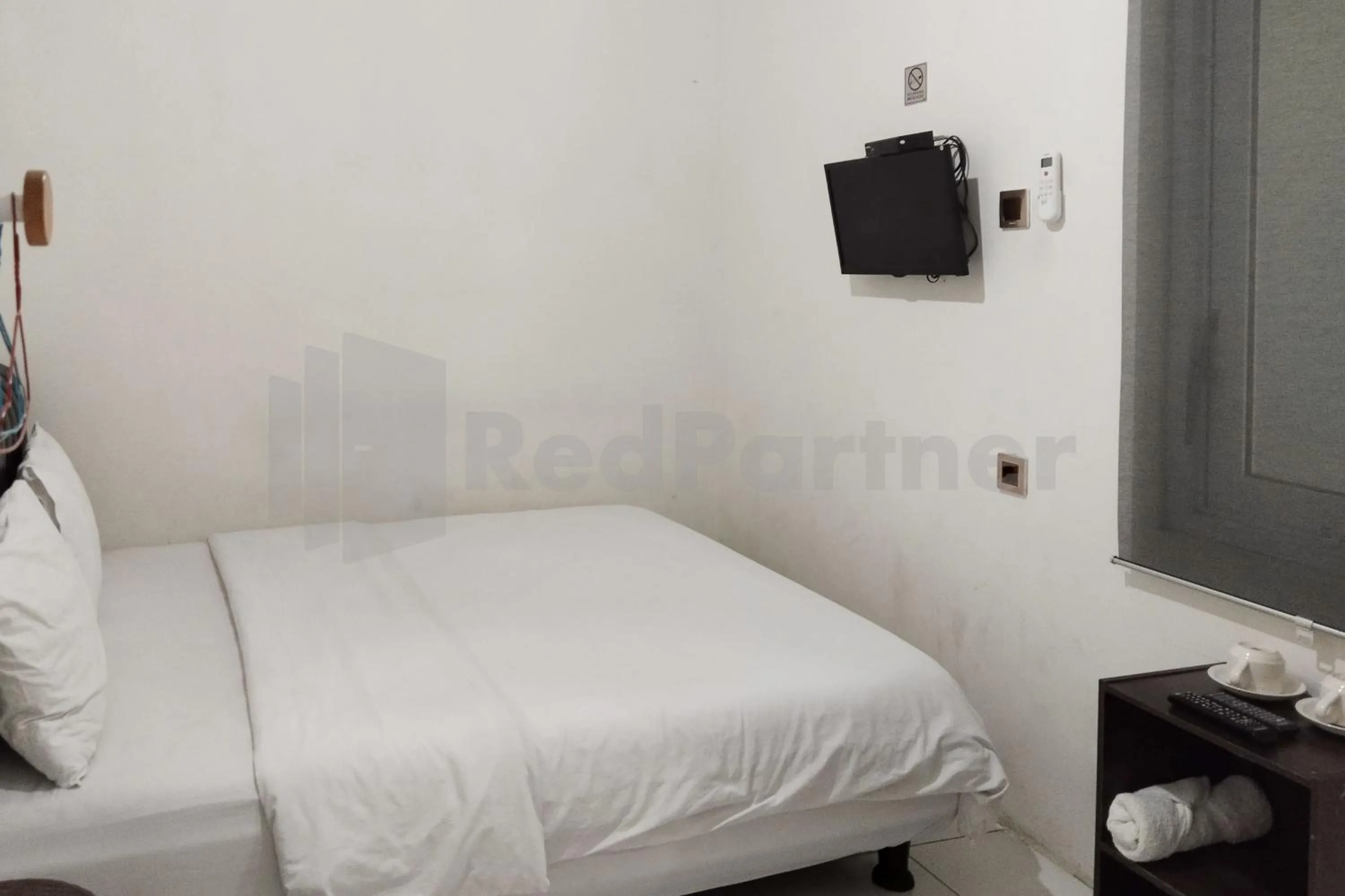 Bedroom in House Of Mahira Syariah Mitra RedDoorz