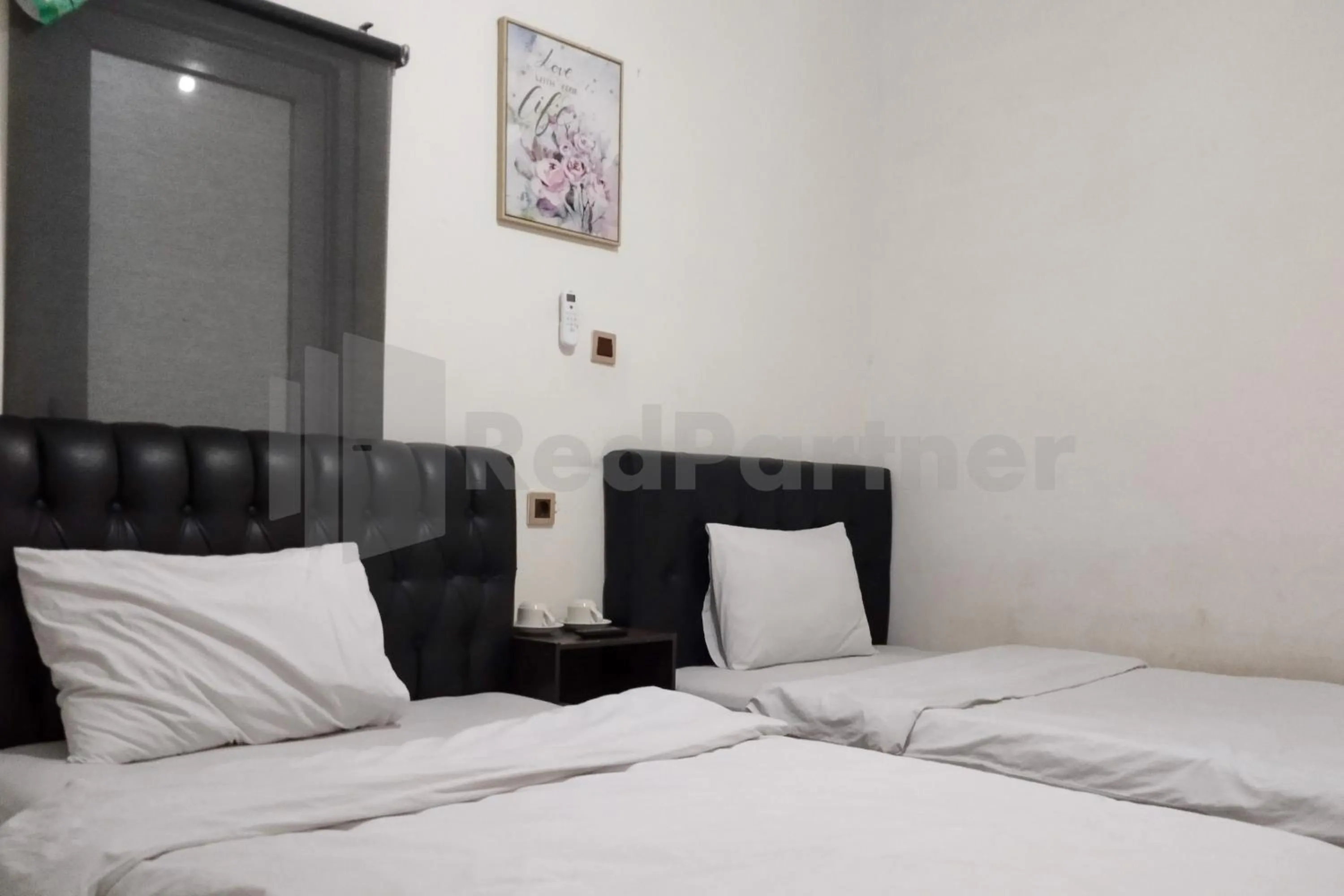 Bedroom in House Of Mahira Syariah Mitra RedDoorz