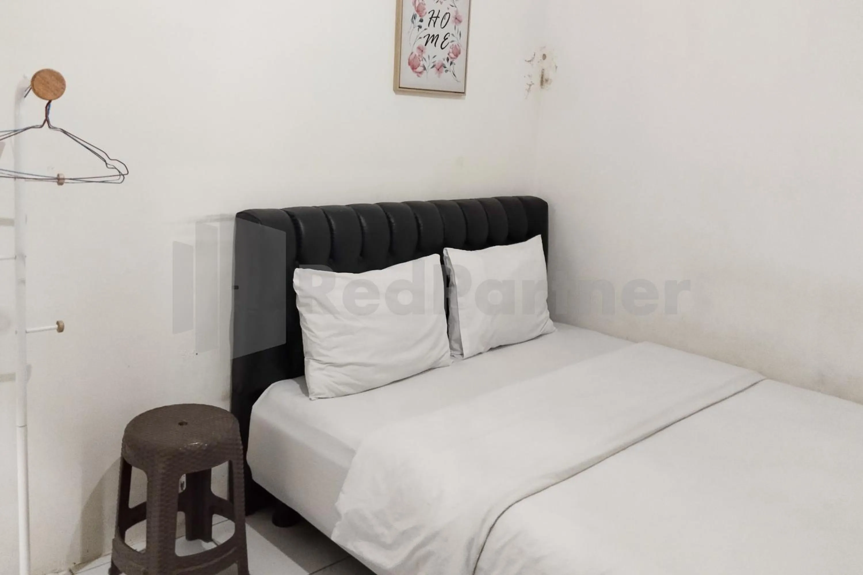 Bedroom in House Of Mahira Syariah Mitra RedDoorz