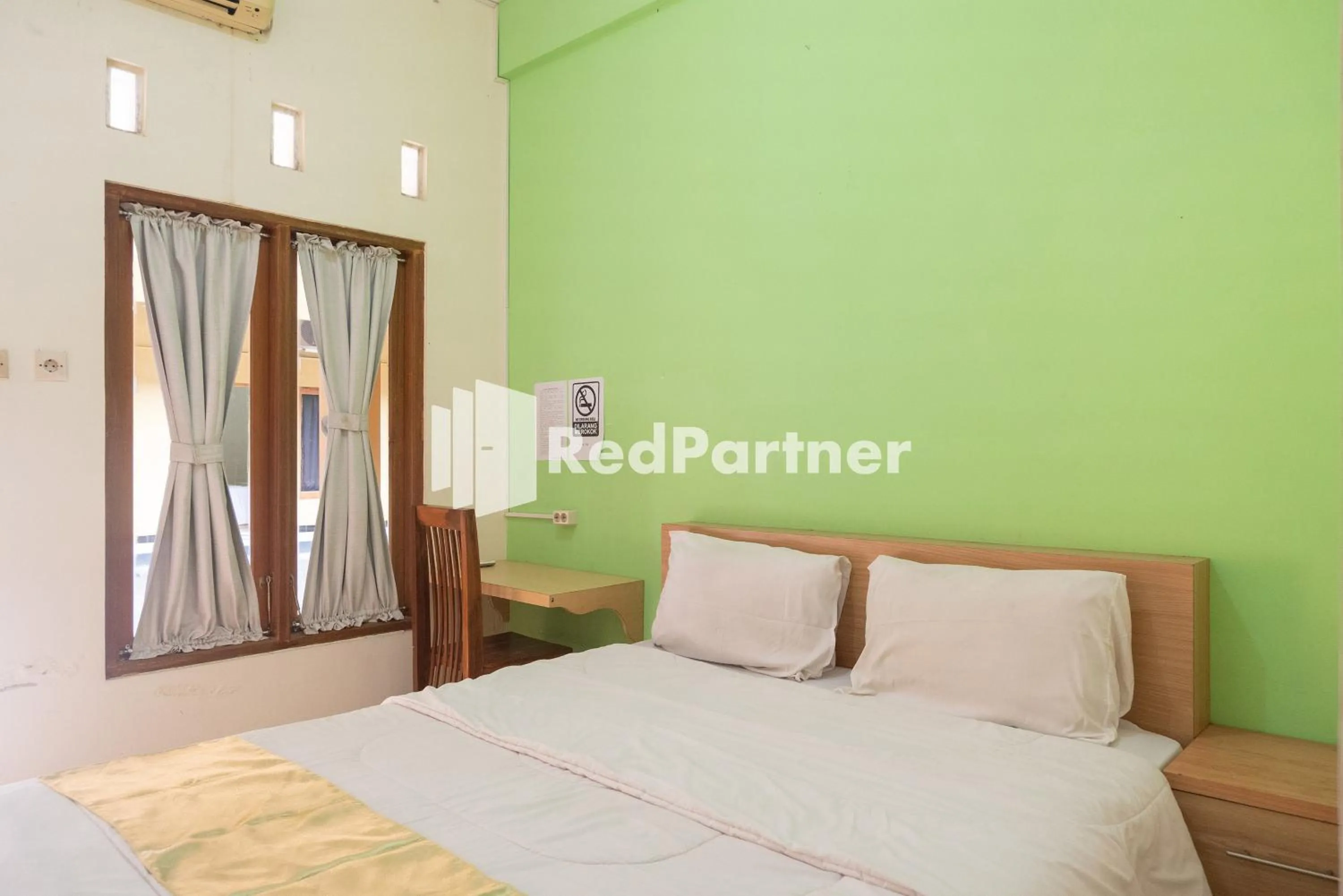 Bedroom, Bed in Wisma Handayani Syariah RedPartner near RSUD Wonosari