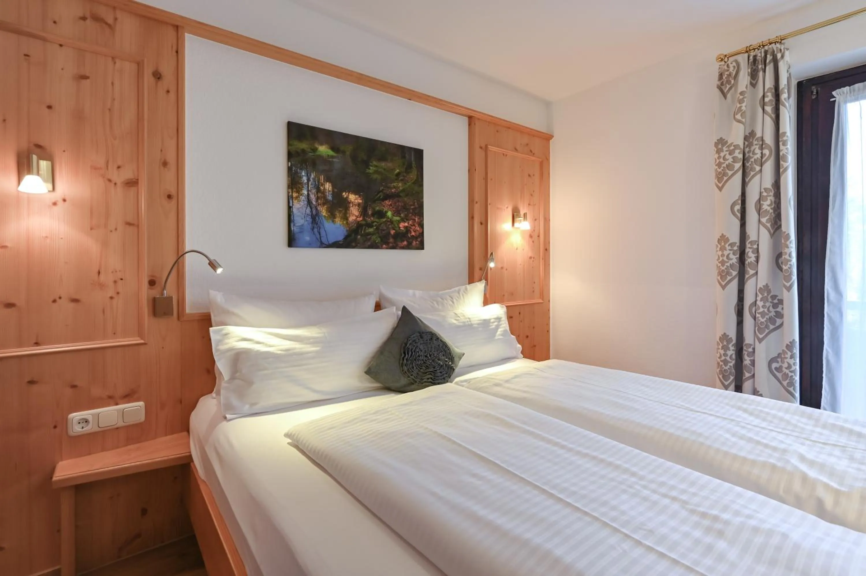 Bed in Hotel Alpenstuben