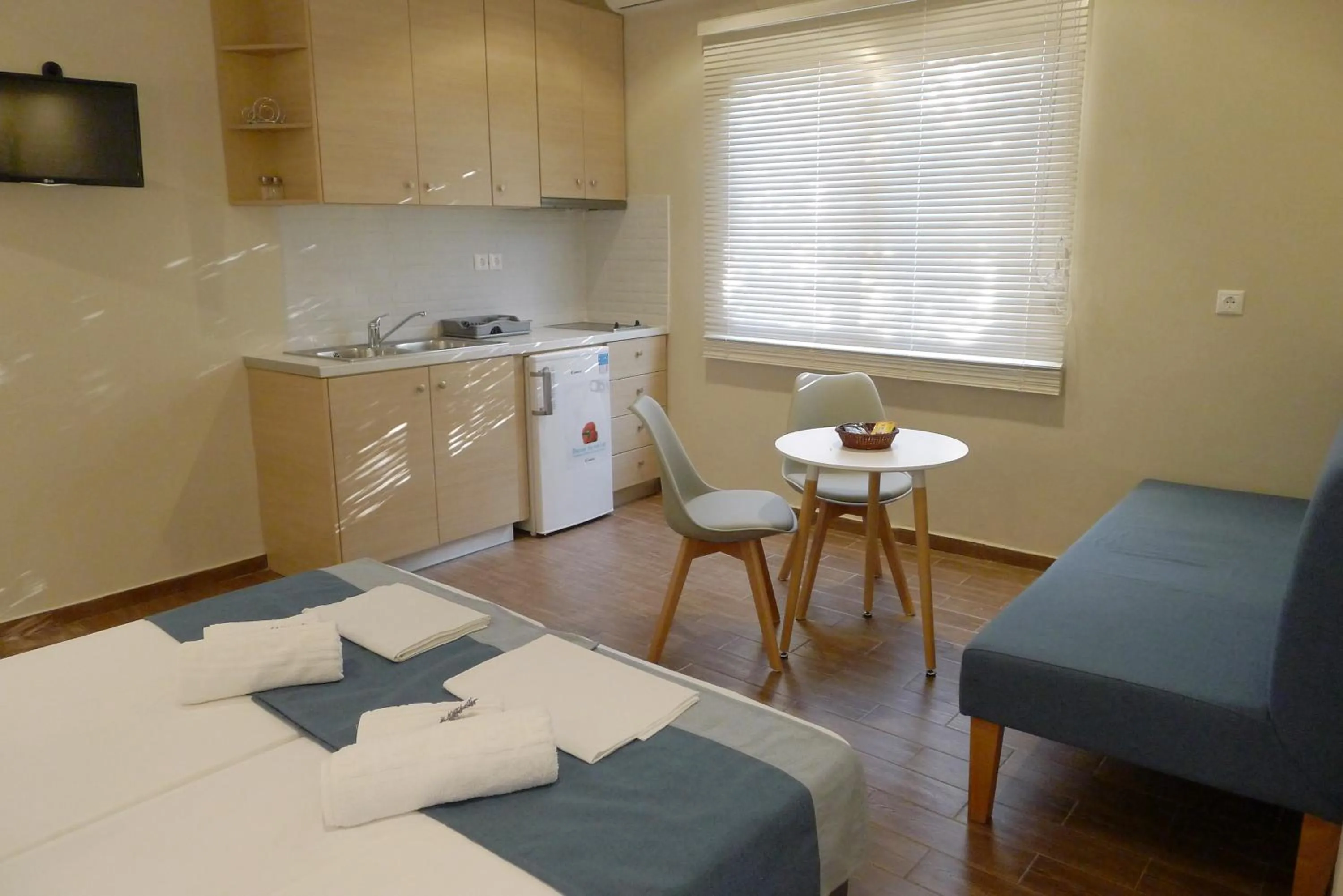 Bed in Ampoulos Rooms & Apartments