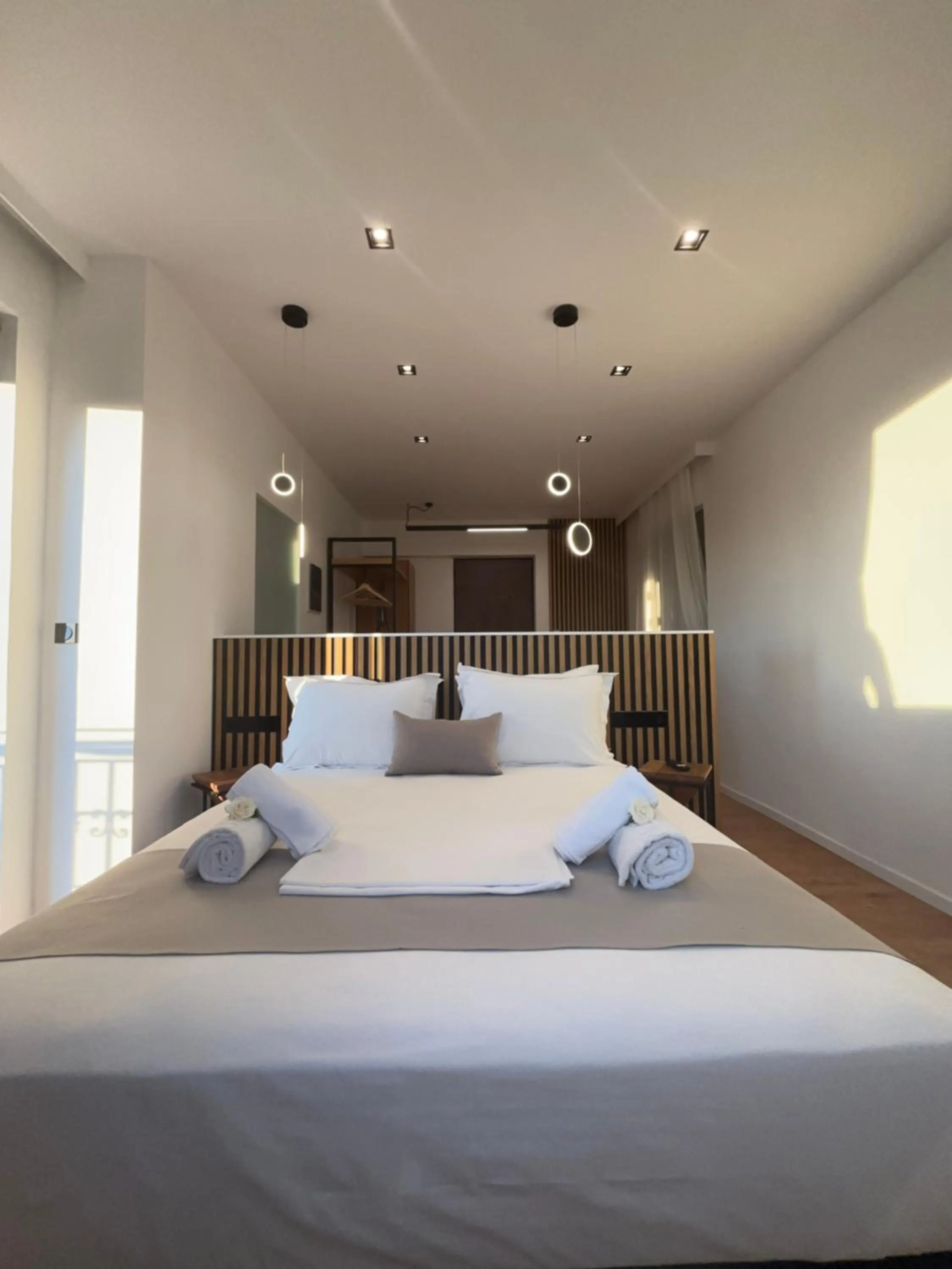 Bed in Ampoulos Rooms & Apartments