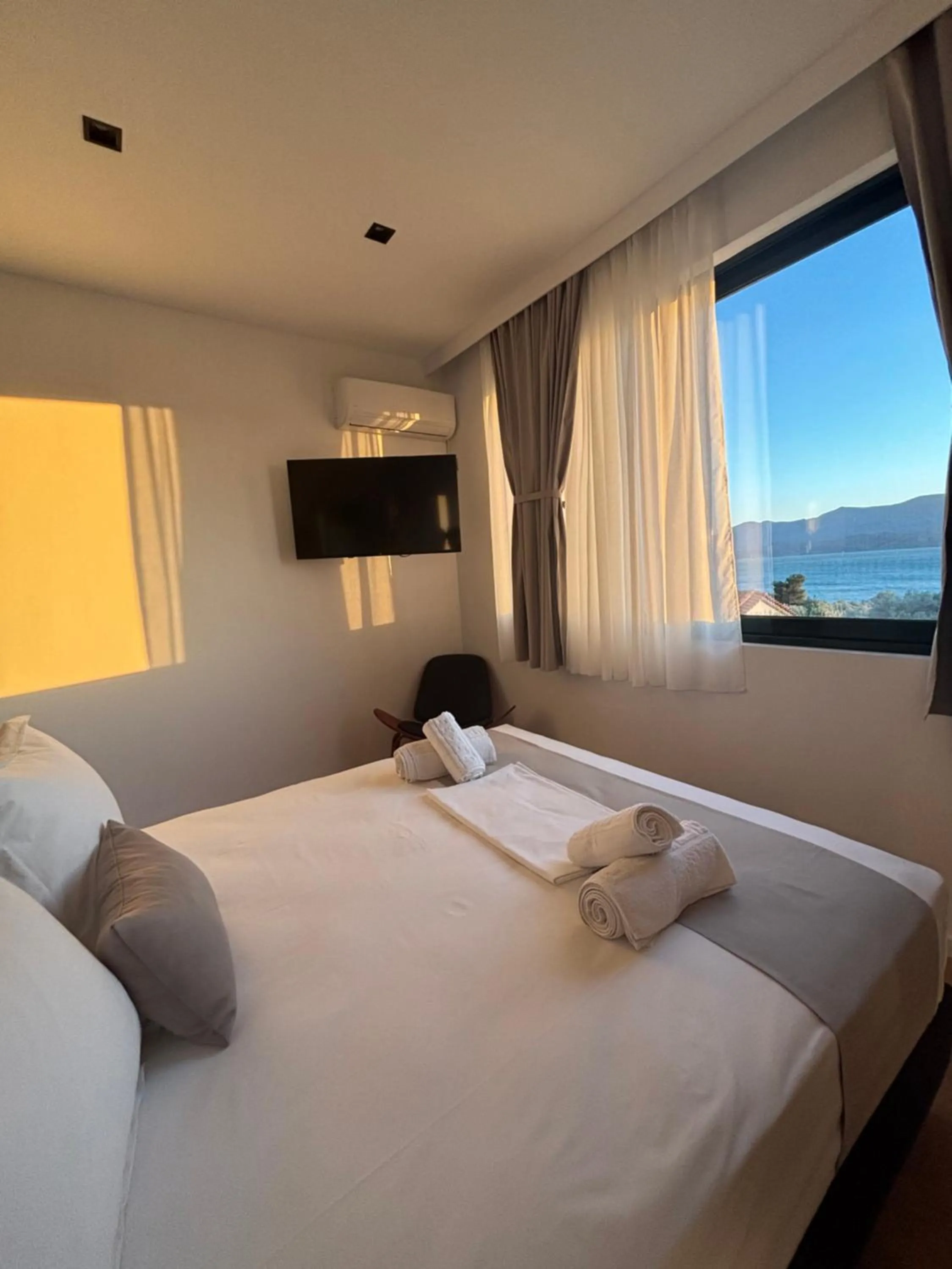 Bed in Ampoulos Rooms & Apartments