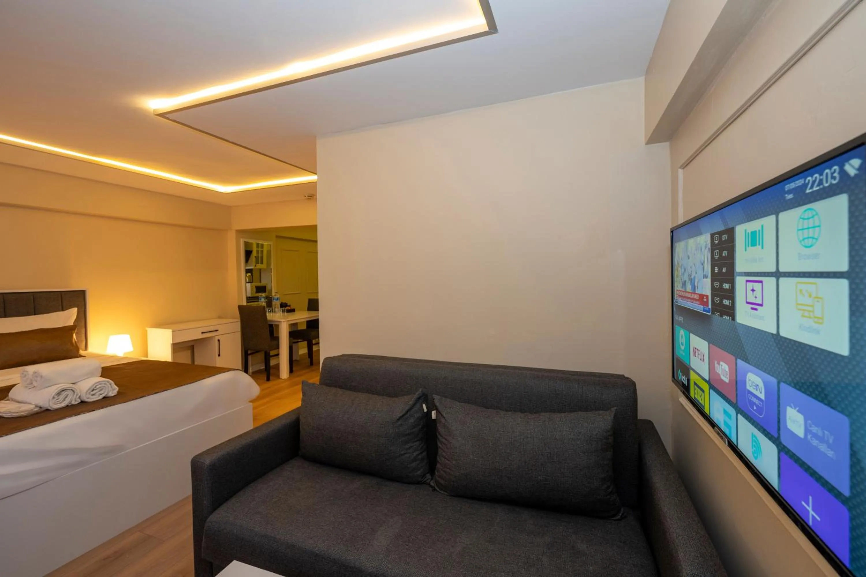 Living room, Bed in Aiza Suites