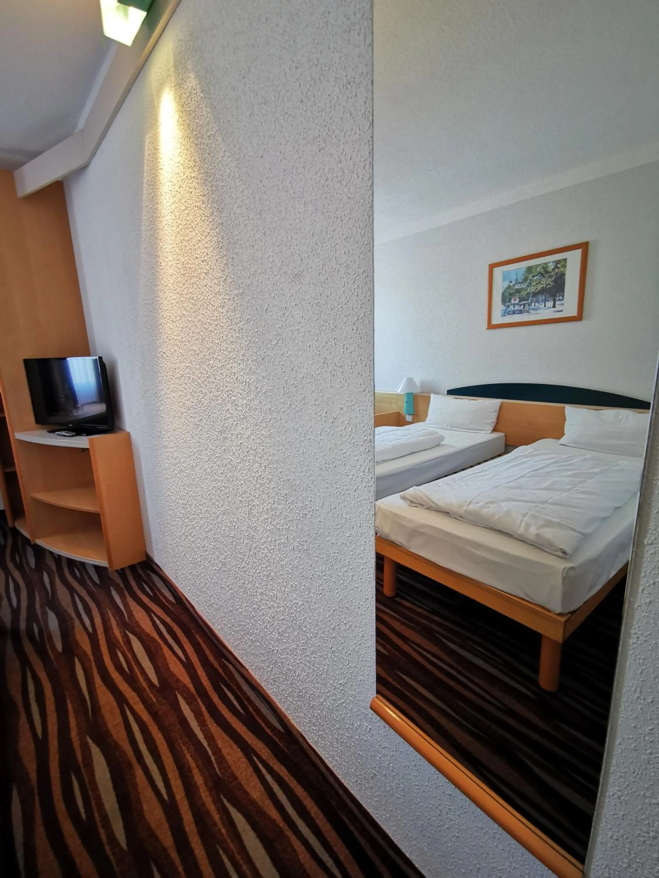 Bed in Plaza Inn Berlin Süd Ludwigsfelde