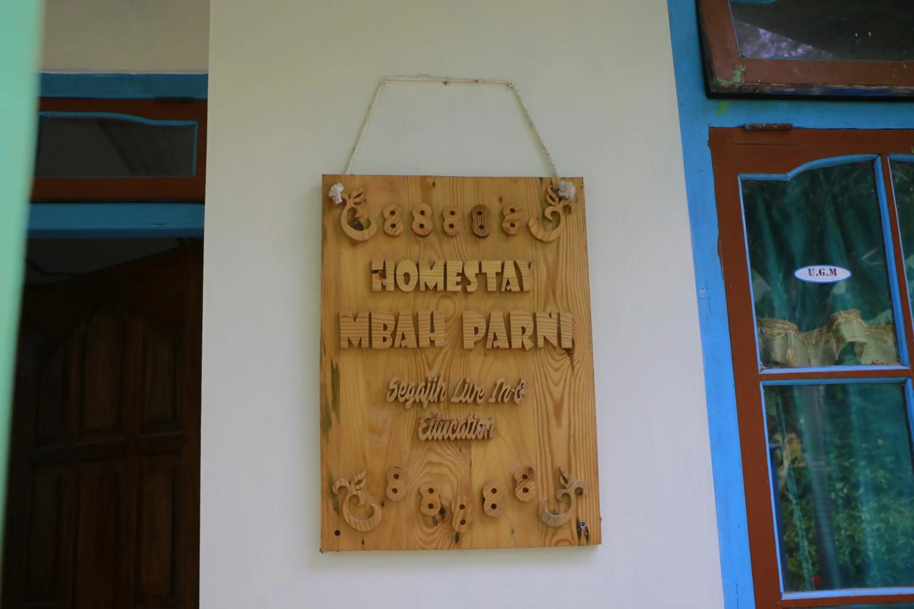Property logo or sign in Homestay Mbah Parni