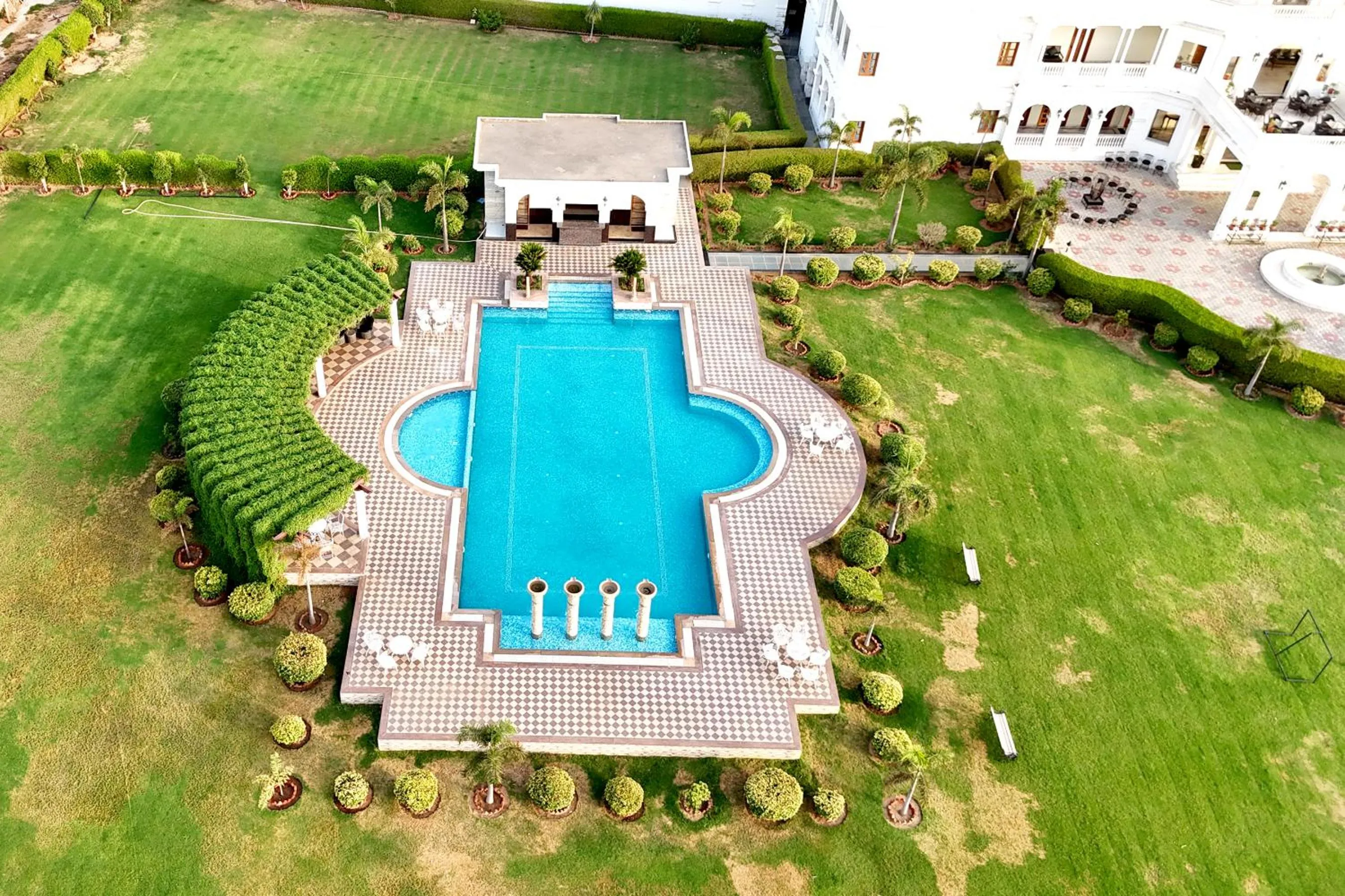 Swimming pool in Umaid Farm Resort- A Legancy Vintage Stay In Jaipur