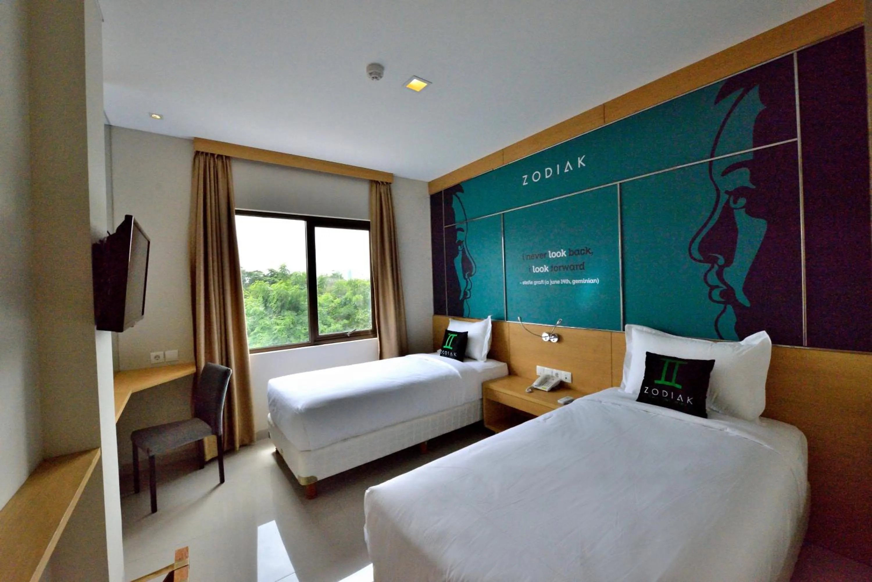Photo of the whole room, Bed in Zodiak MT Haryono by KAGUM Hotels