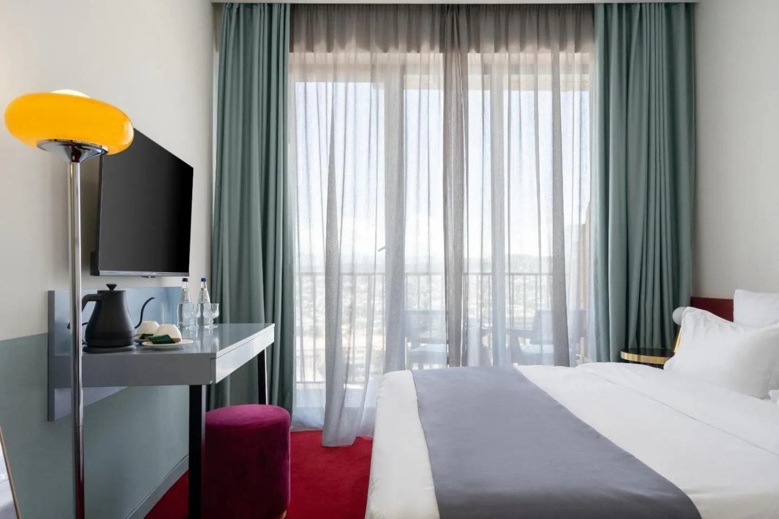 Communal lounge/ TV room, Bed in Tbilisi View Hotel