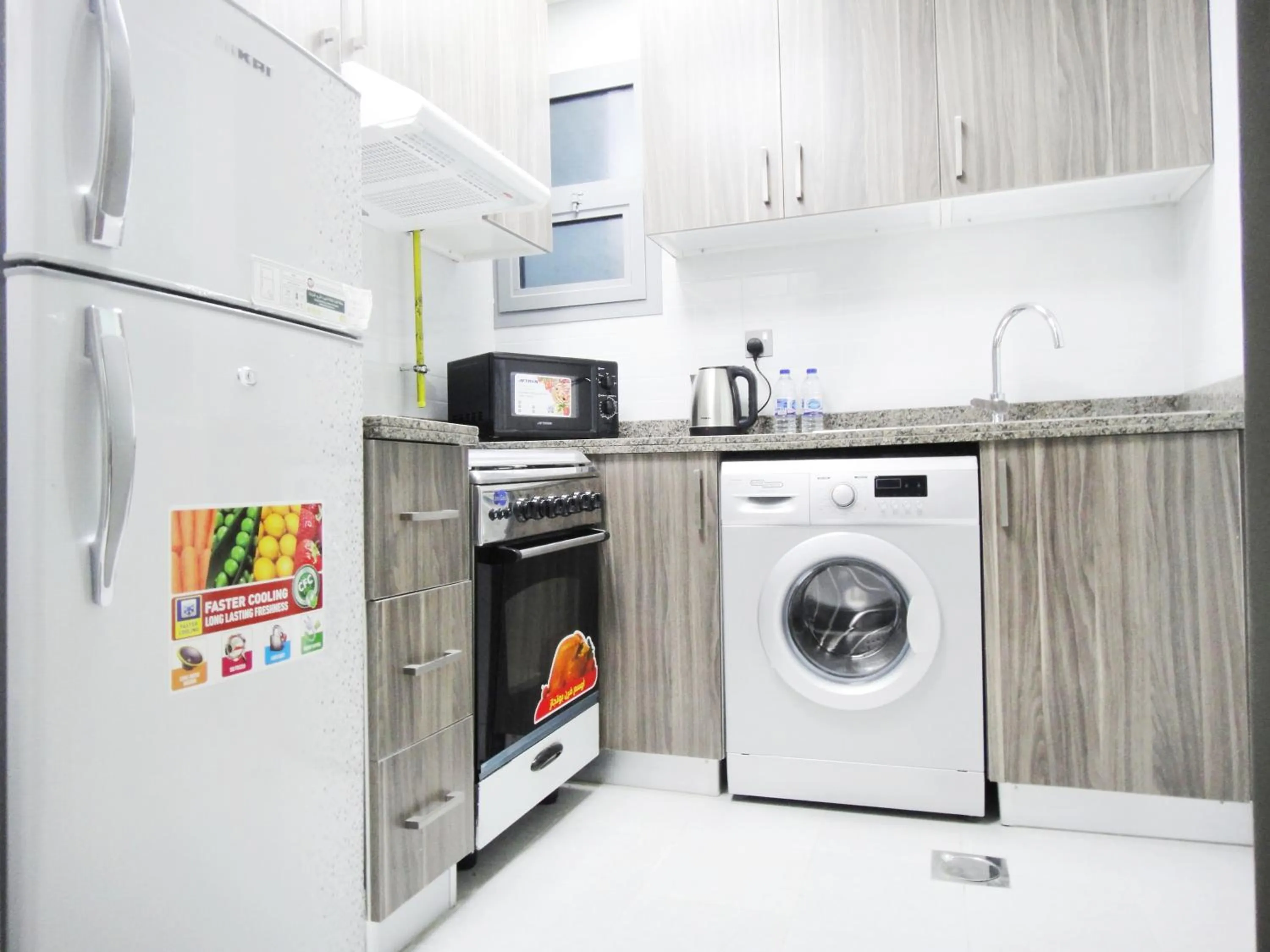 Kitchen or kitchenette in Warsan Star Residence - Home Stay