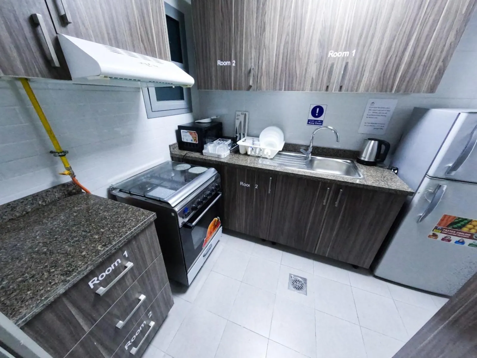 Kitchen or kitchenette in Warsan Star Residence - Home Stay
