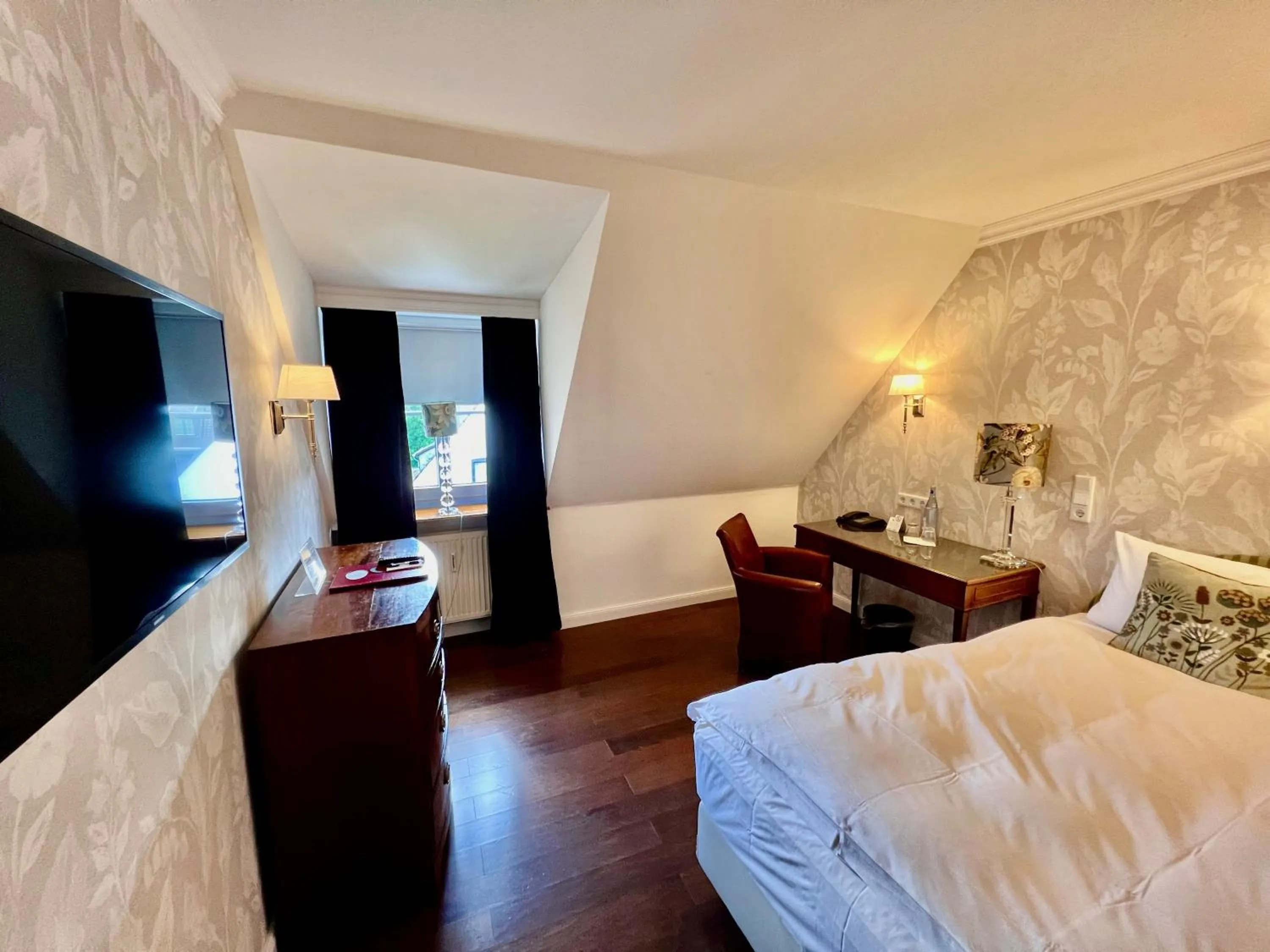 Bed in Hotel Ashley's Garden