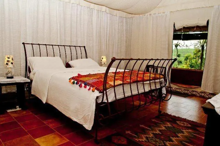 Bed in Grassroots Wayanad, Valley-view Tents