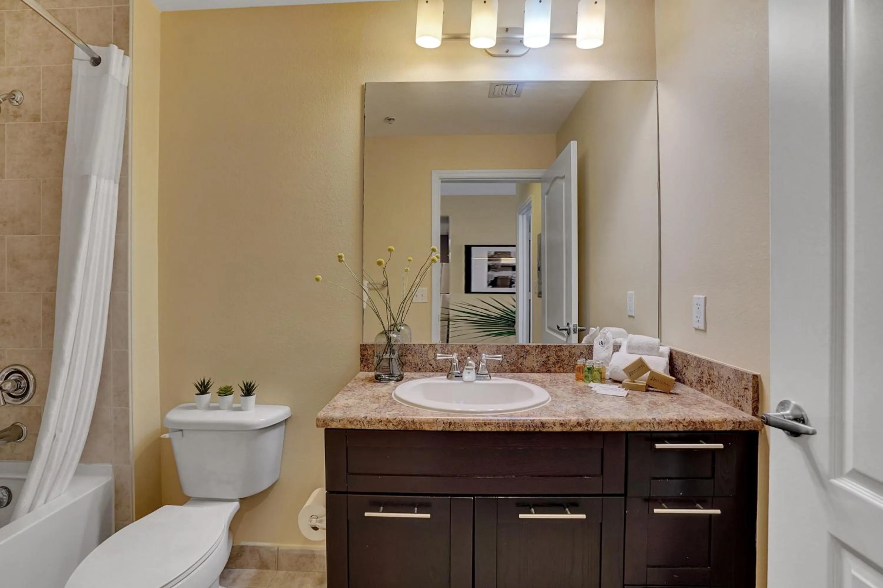 Bathroom in Dharma Home Suites South Miami at Red Road Commons